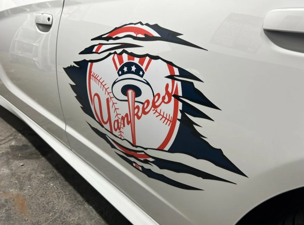Custom vinyl logo applied to a car