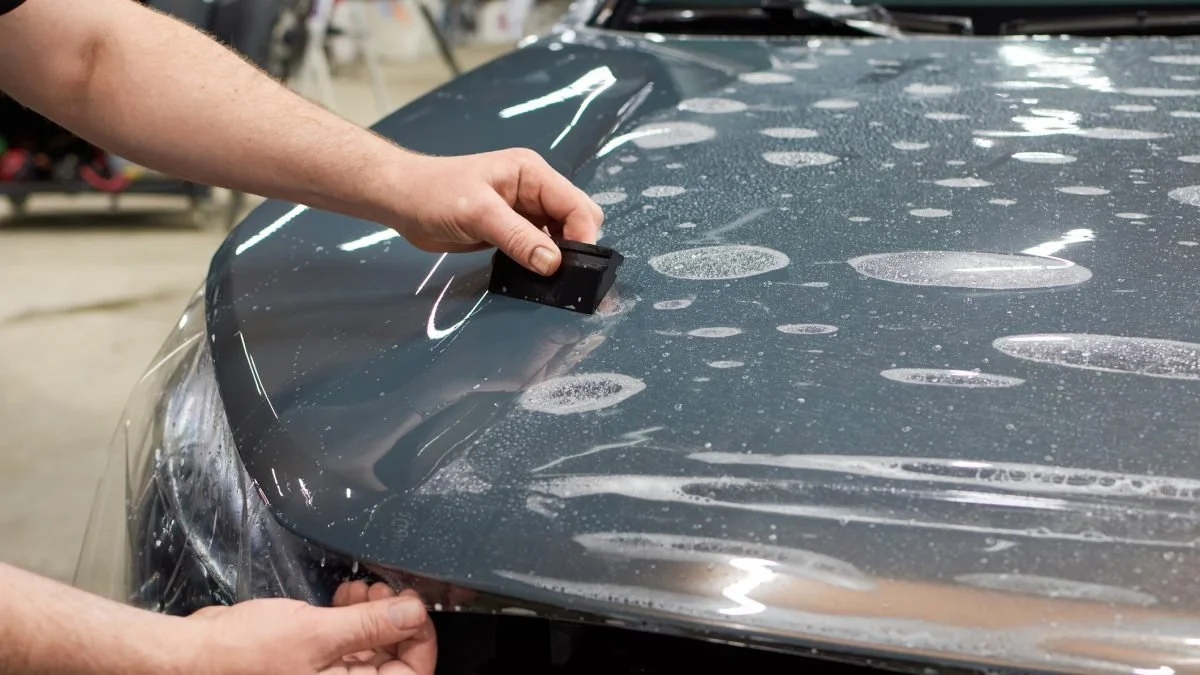 Closeup shot of PPF being applied to a vehicle