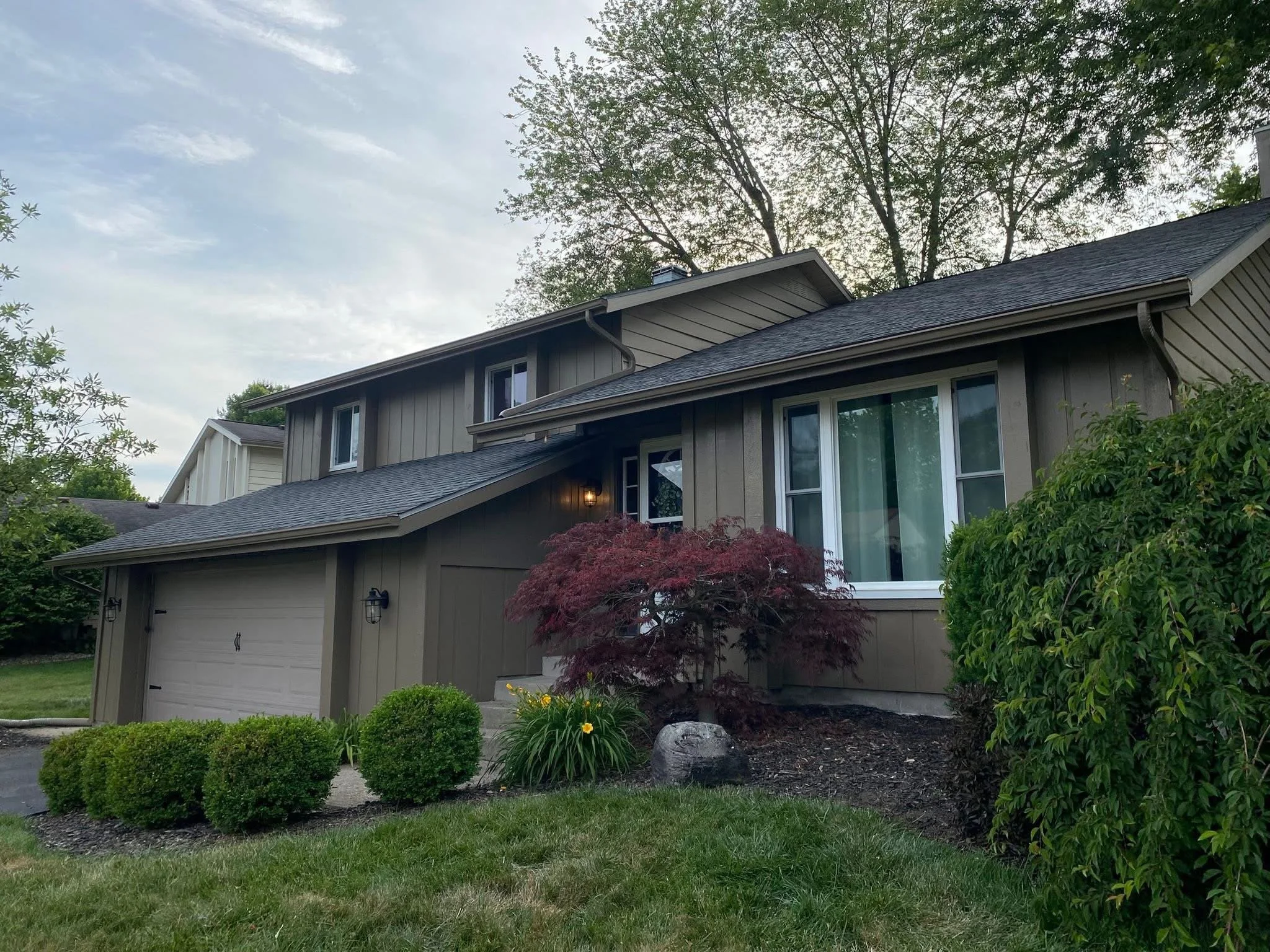 Exterior house painting in Monroe County Michigan by Consumer Painting Company