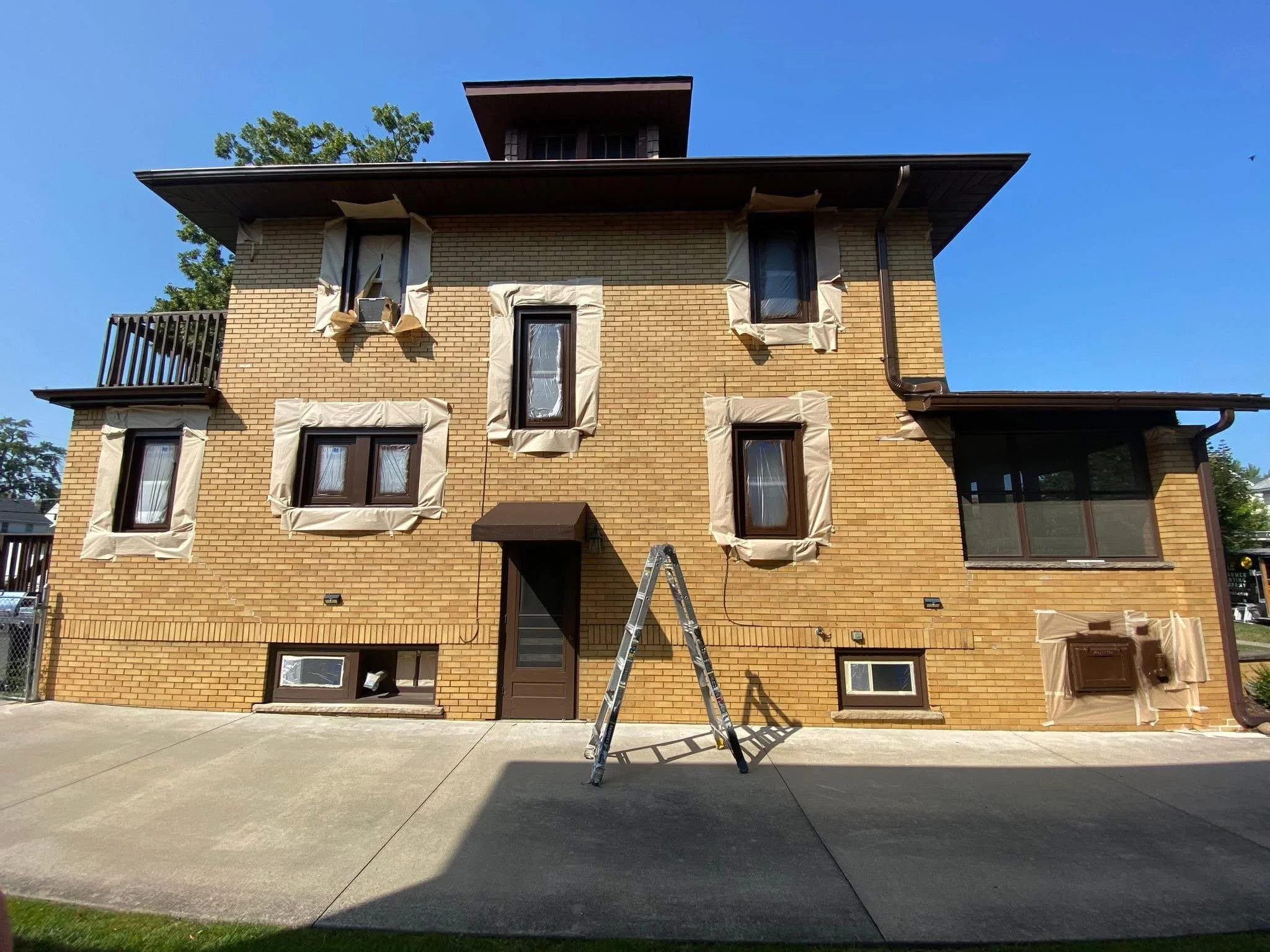 Exterior house painting in Monroe County Michigan by Consumer Painting Company