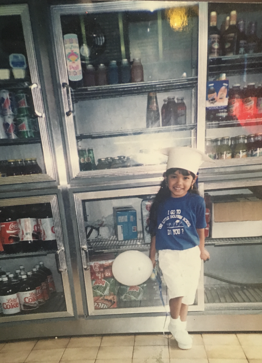 Kristian posing after her graduation from Little Dolphin Pre-School in 1995.