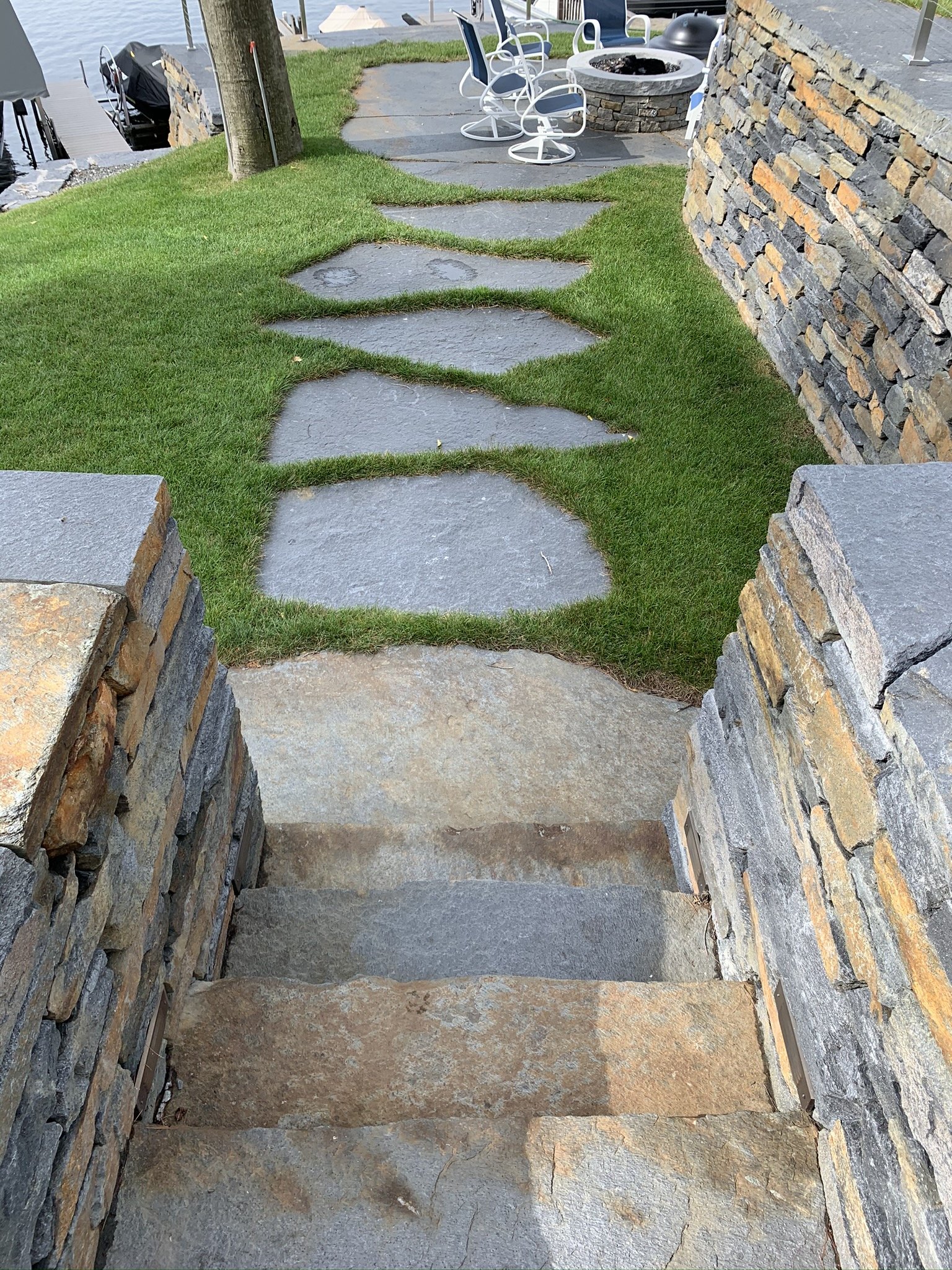 The combination of the staircase, Goshen flagging stones and firepit creates an enchanting setting for hosting and enjoying moments with friends and family
