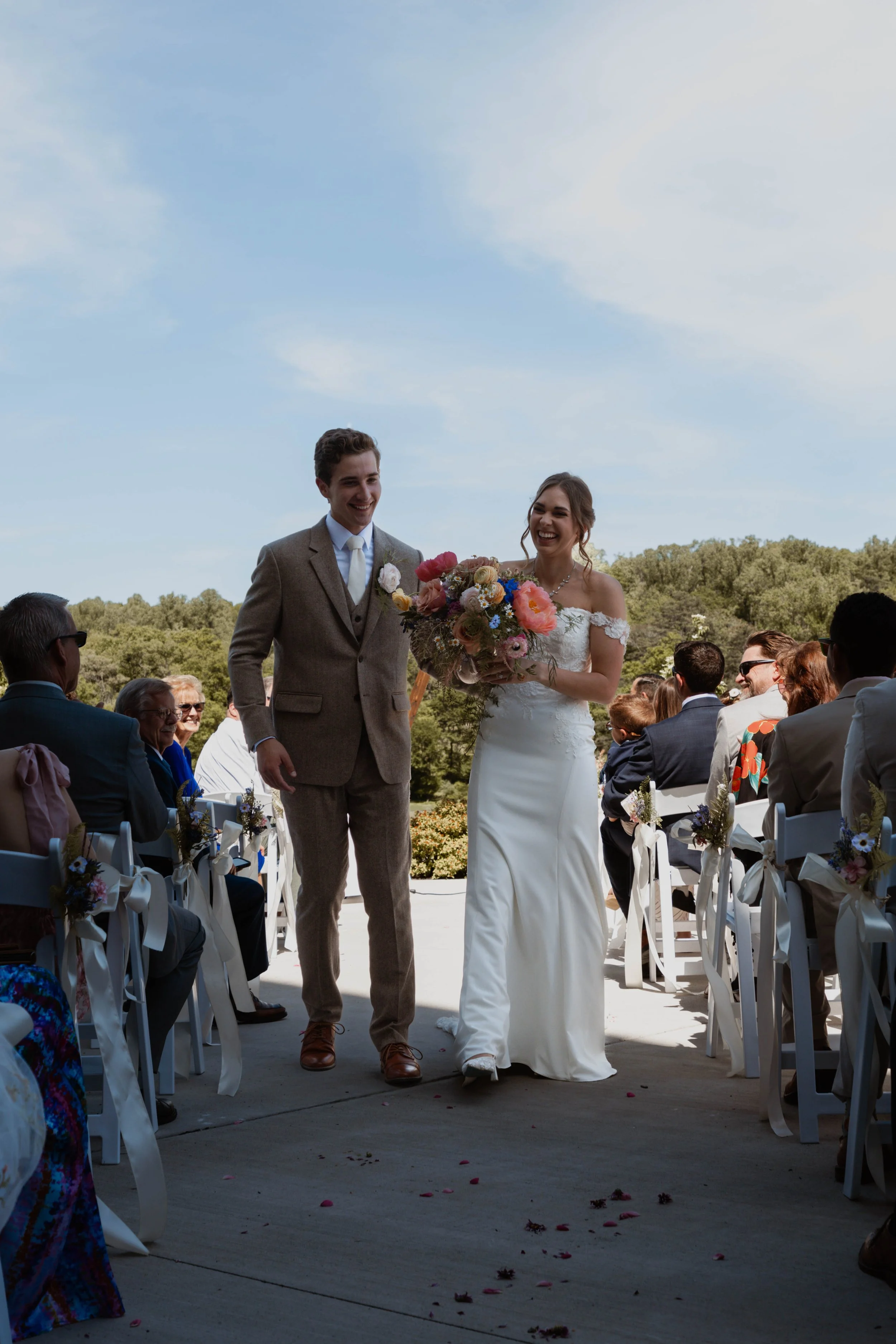 Bride and Groom Walking Down the Isle Together.jpg