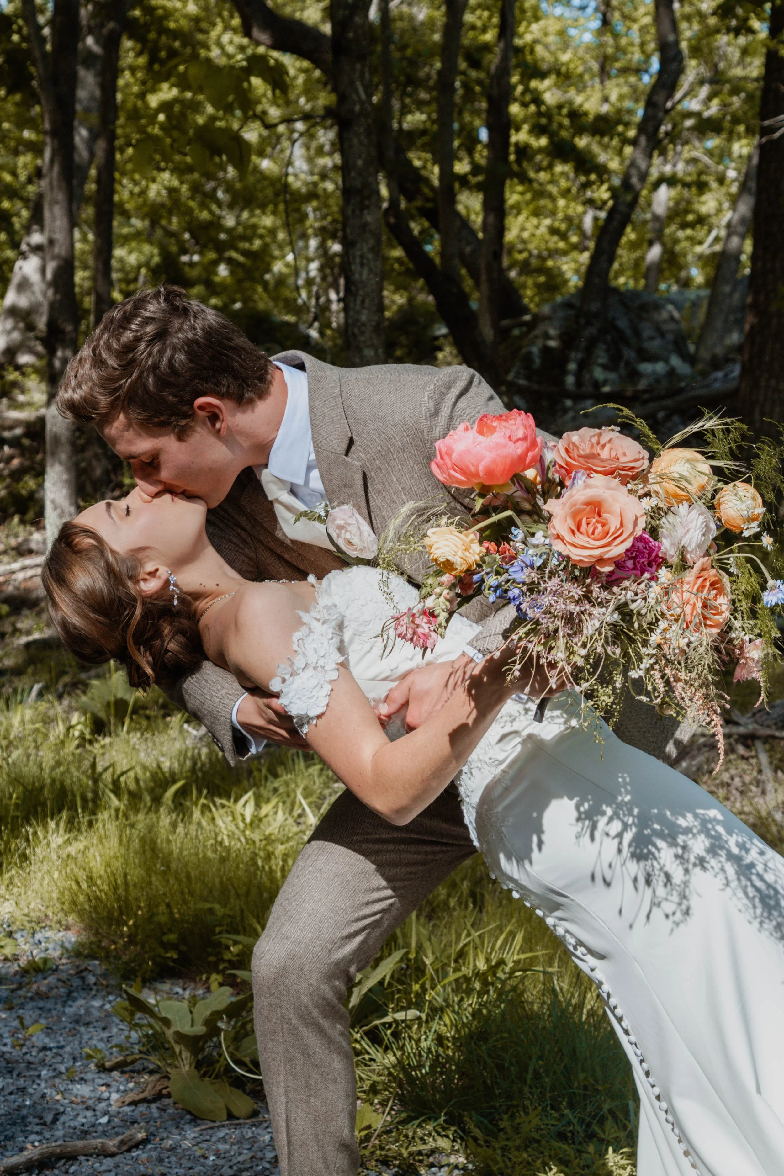 Groom Dipping Bride and Kissing Her.jpg