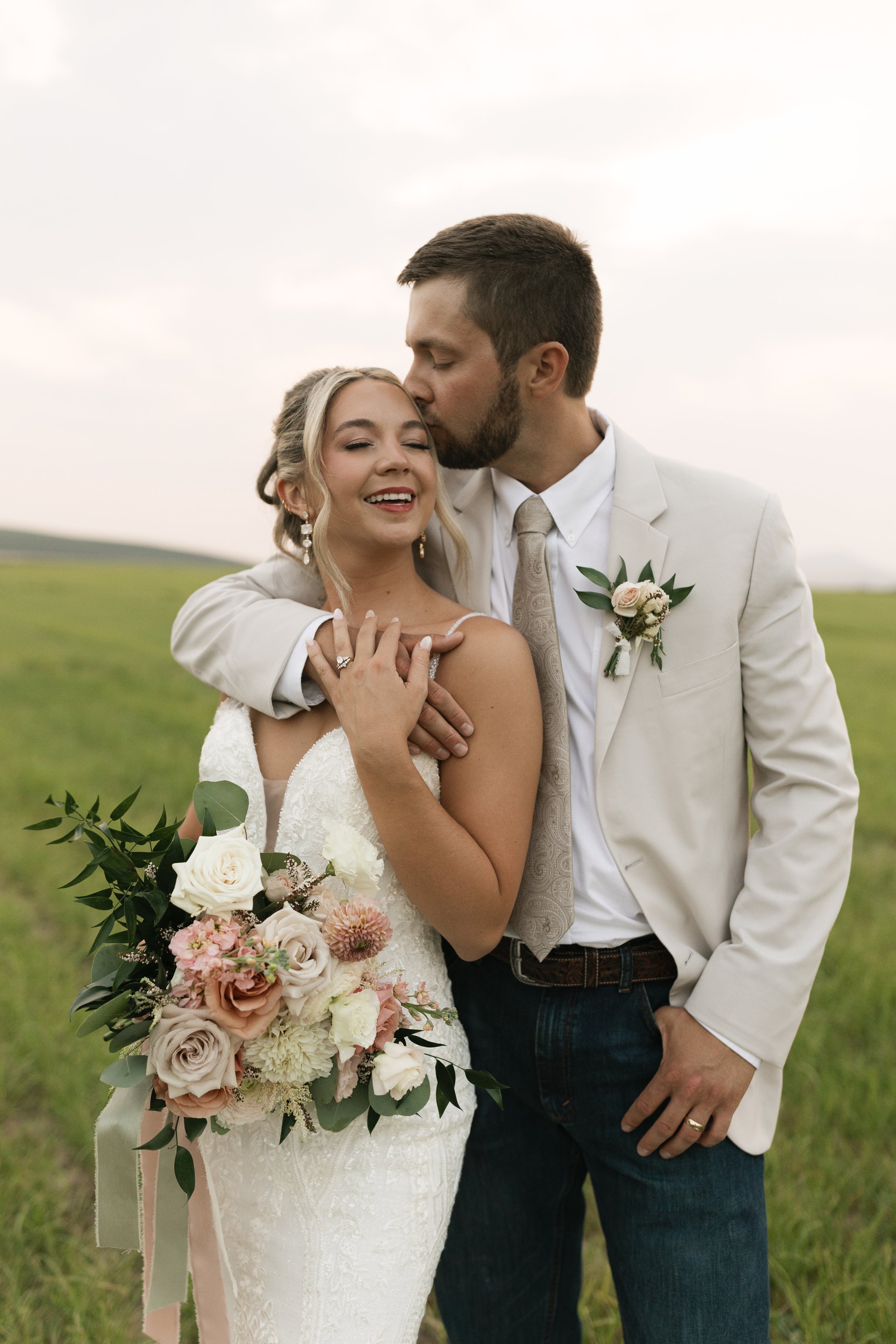 Soft blush, peach, and sage wedding with roses, poppy pods, calcynia, eucalyptus, ranunculus, dahlias at Gooseridge Winery Park Benton City WA