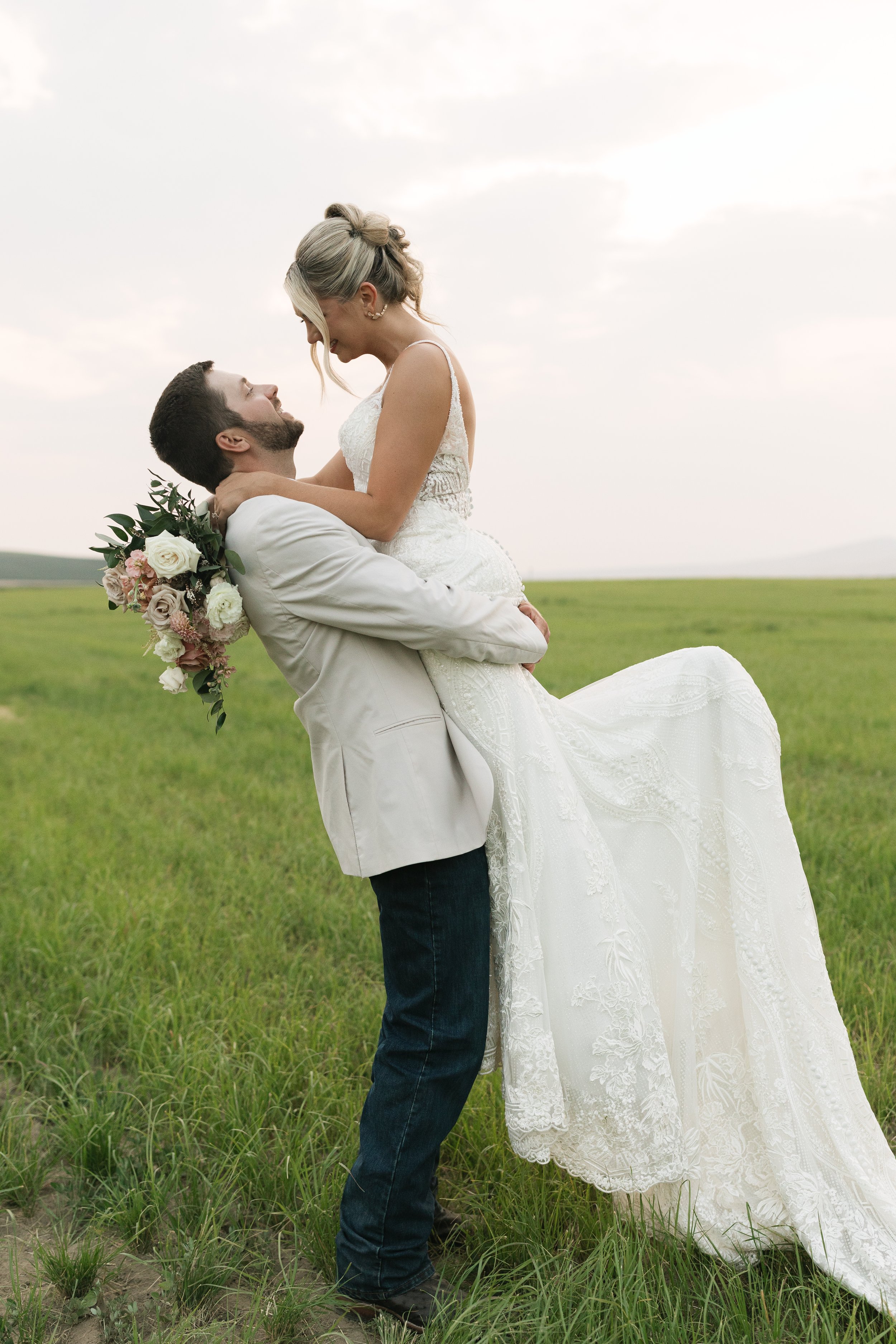 Soft blush, peach, and sage wedding with roses, poppy pods, calcynia, eucalyptus, ranunculus, dahlias at Gooseridge Winery Park Benton City WA
