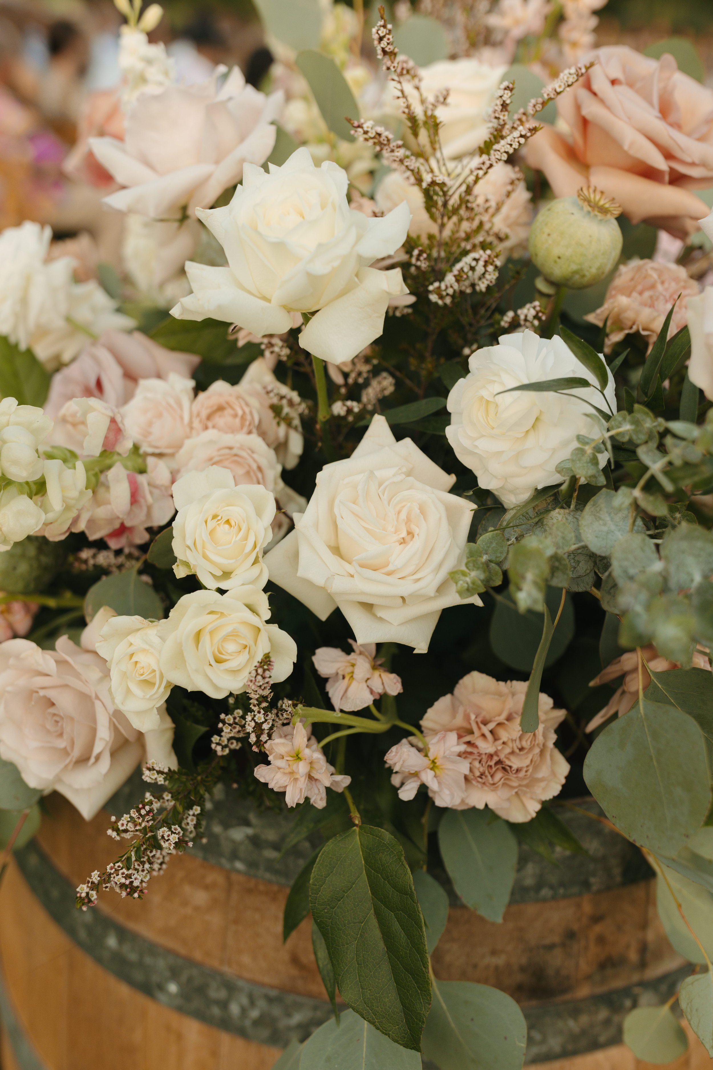 Soft blush, peach, and sage wedding with roses, poppy pods, calcynia, eucalyptus, ranunculus, dahlias at Gooseridge Winery Park Benton City WA