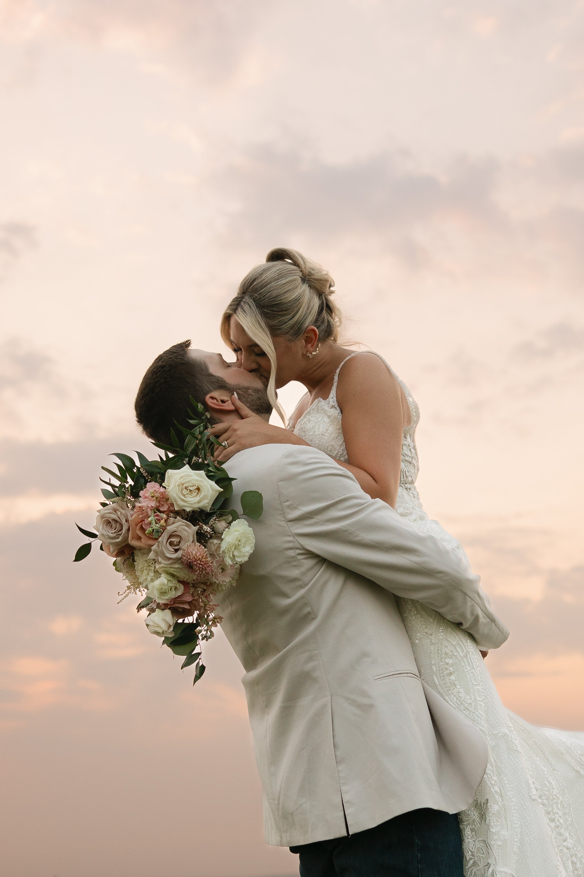 Soft blush, peach, and sage wedding with roses, poppy pods, calcynia, eucalyptus, ranunculus, dahlias at Gooseridge Winery Park Benton City WA