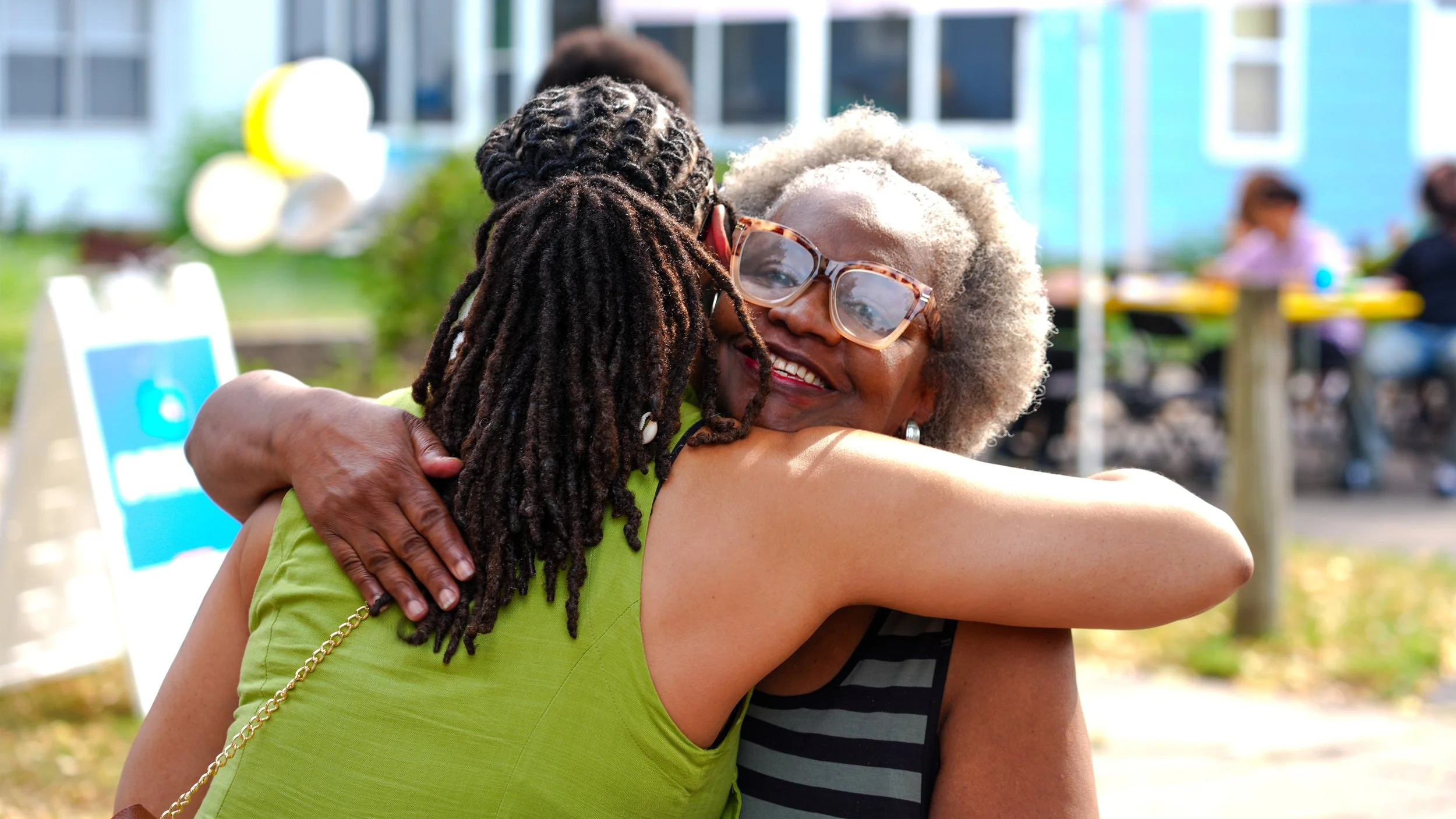KBs Mom Hugging Aarica Coleman .jpg
