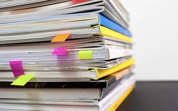 Stack of reports to demonstrate Foresight's Sustainability Reporting service