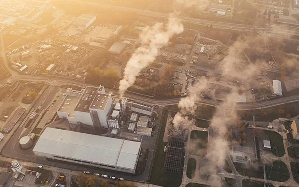 Aerial view of manufacturing facility gas emissions to demonstrate Foresight's Greenhouse Gas Management serivices
