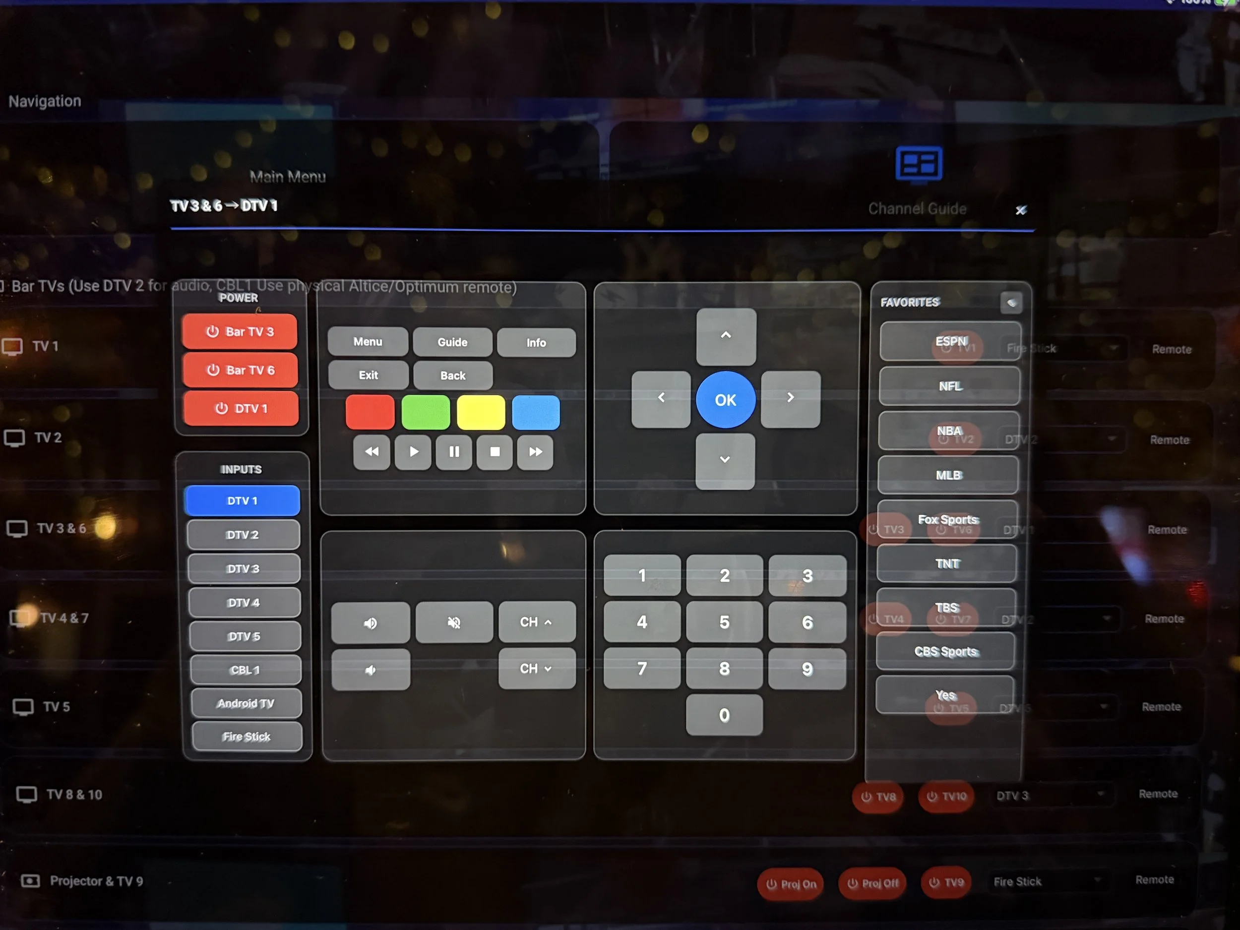 On-screen remote control interface for a television system with channel guide, input options, favorite channels, and control buttons.