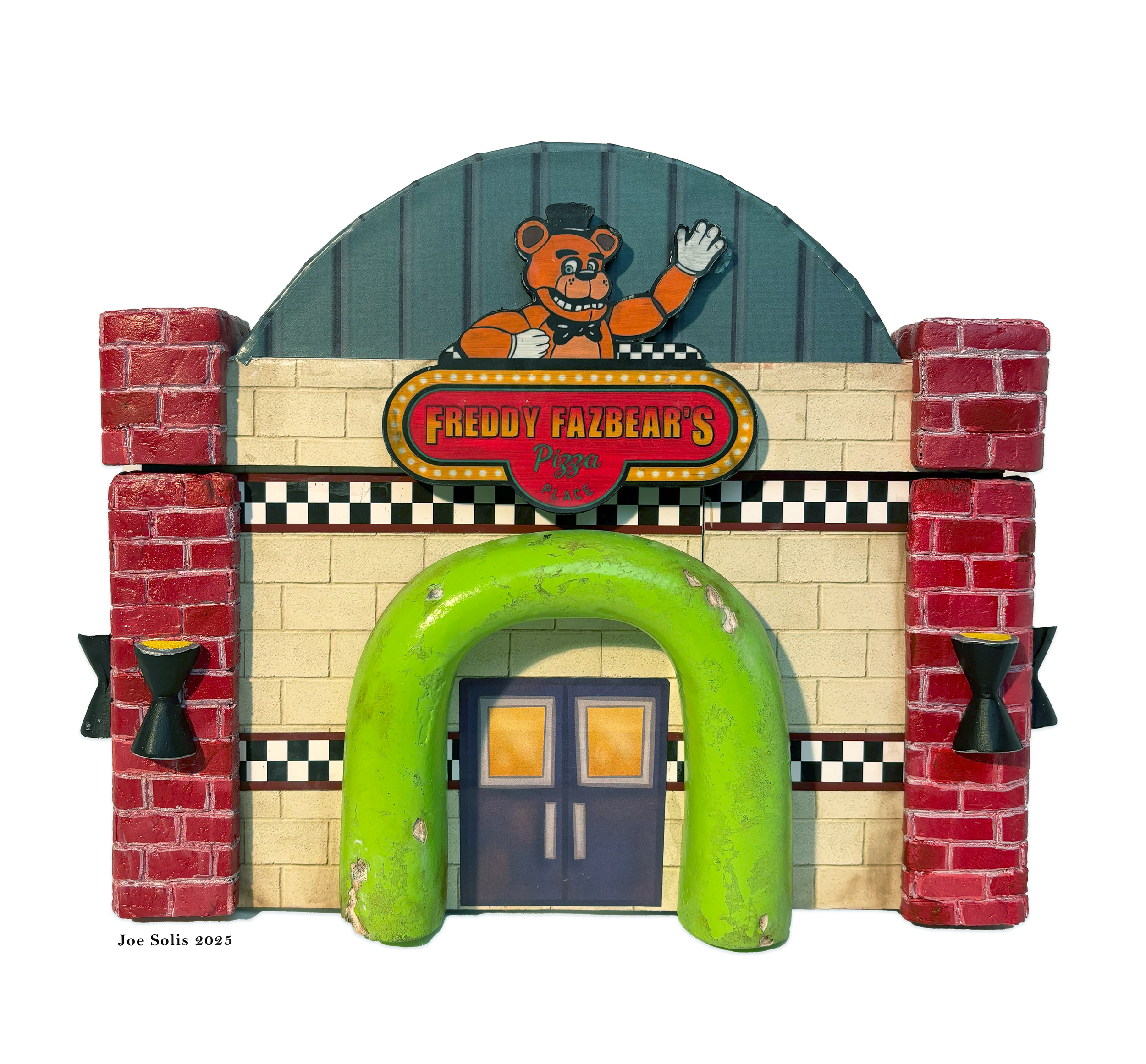 Colorful arcade-style facade with a bear cartoon character waving, a red brick arch, and a sign reading "Freddy Fazbear's Pizza Place."