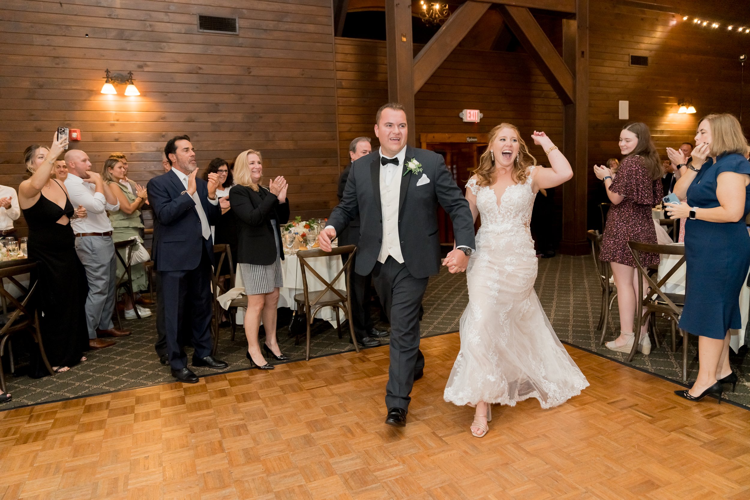 groom and bride in the ballroom at Hollow Brook Club Wedding