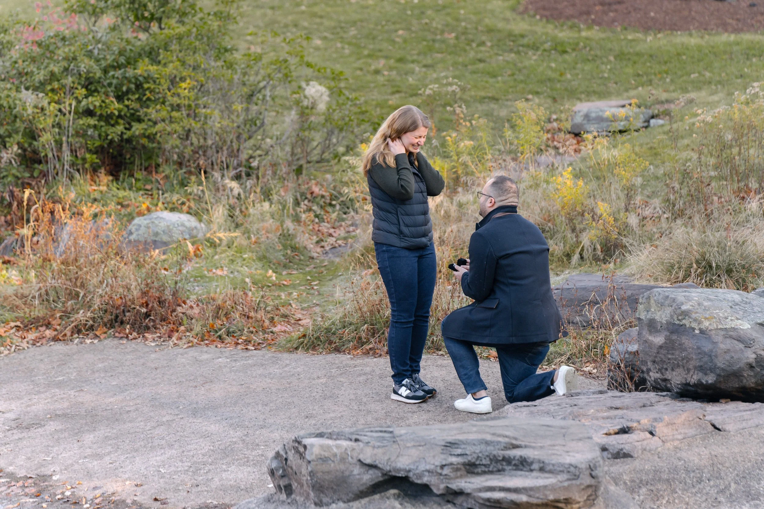 Boyfriend getting on his knee to propose to his girlfriend