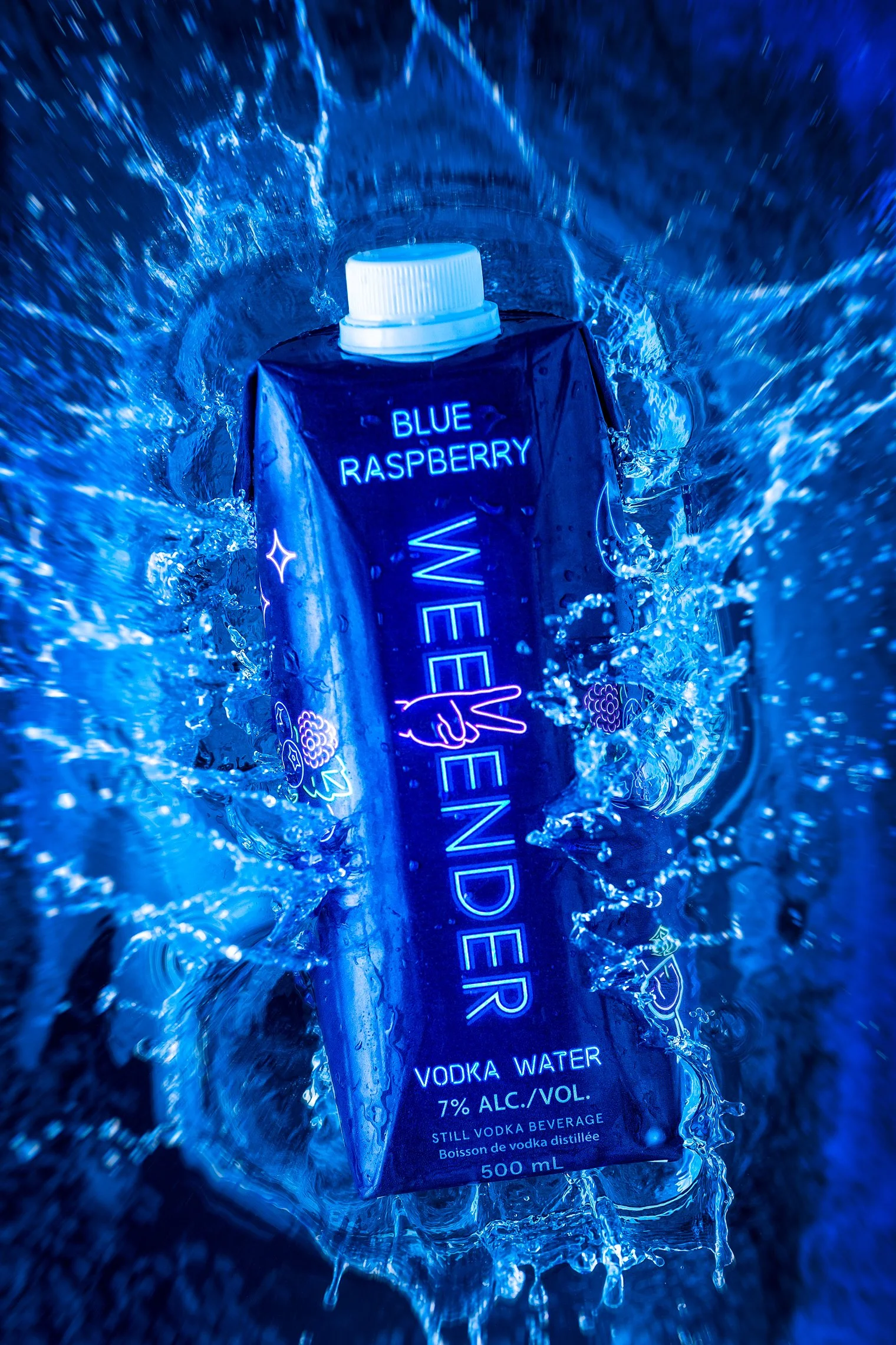 Blue raspberry flavored vodka water beverage in a black carton with a white screw cap, surrounded by splashing water.