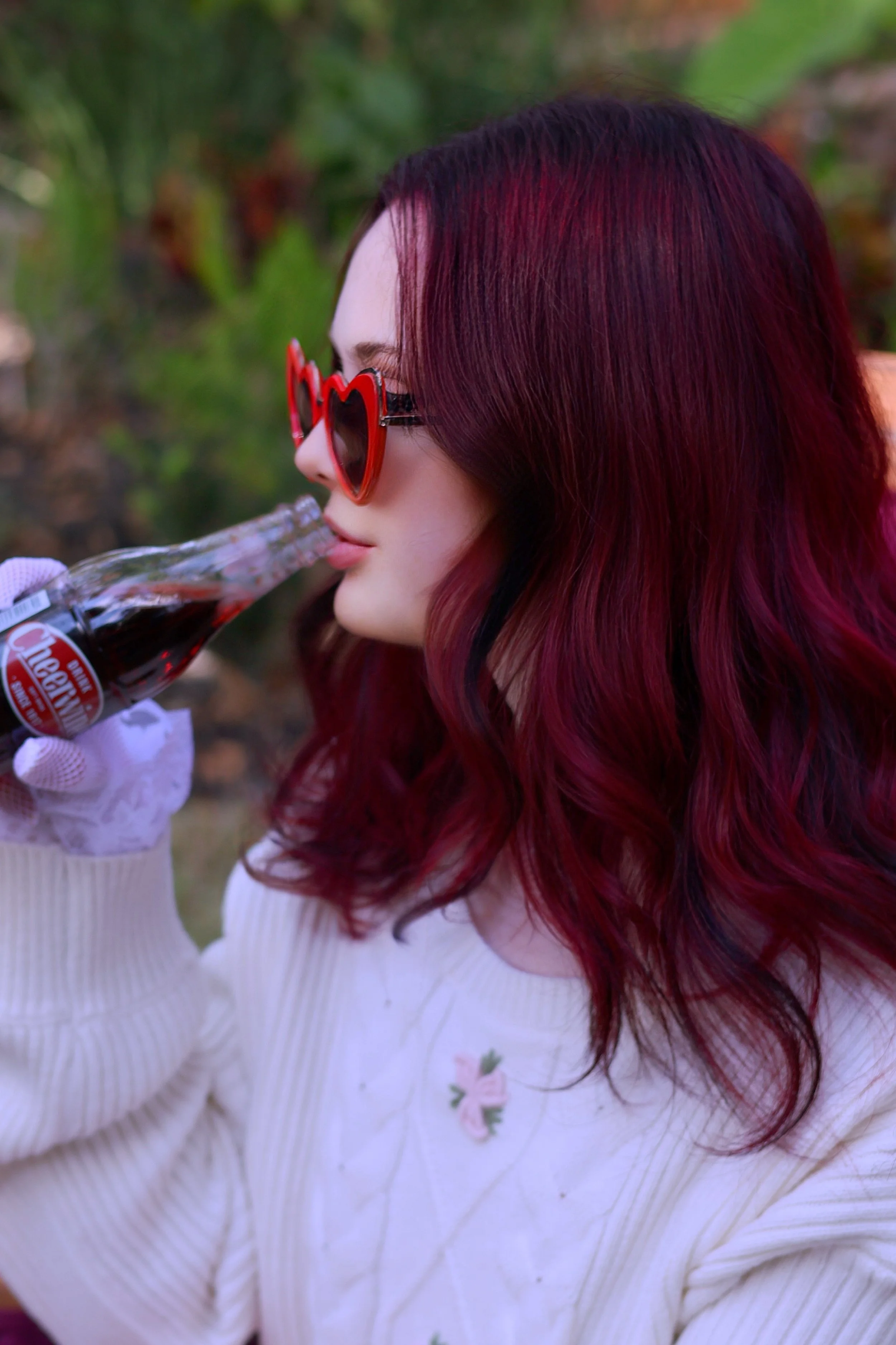 A woman with red hair. Plum Red all-over color with a vivid overlay.
