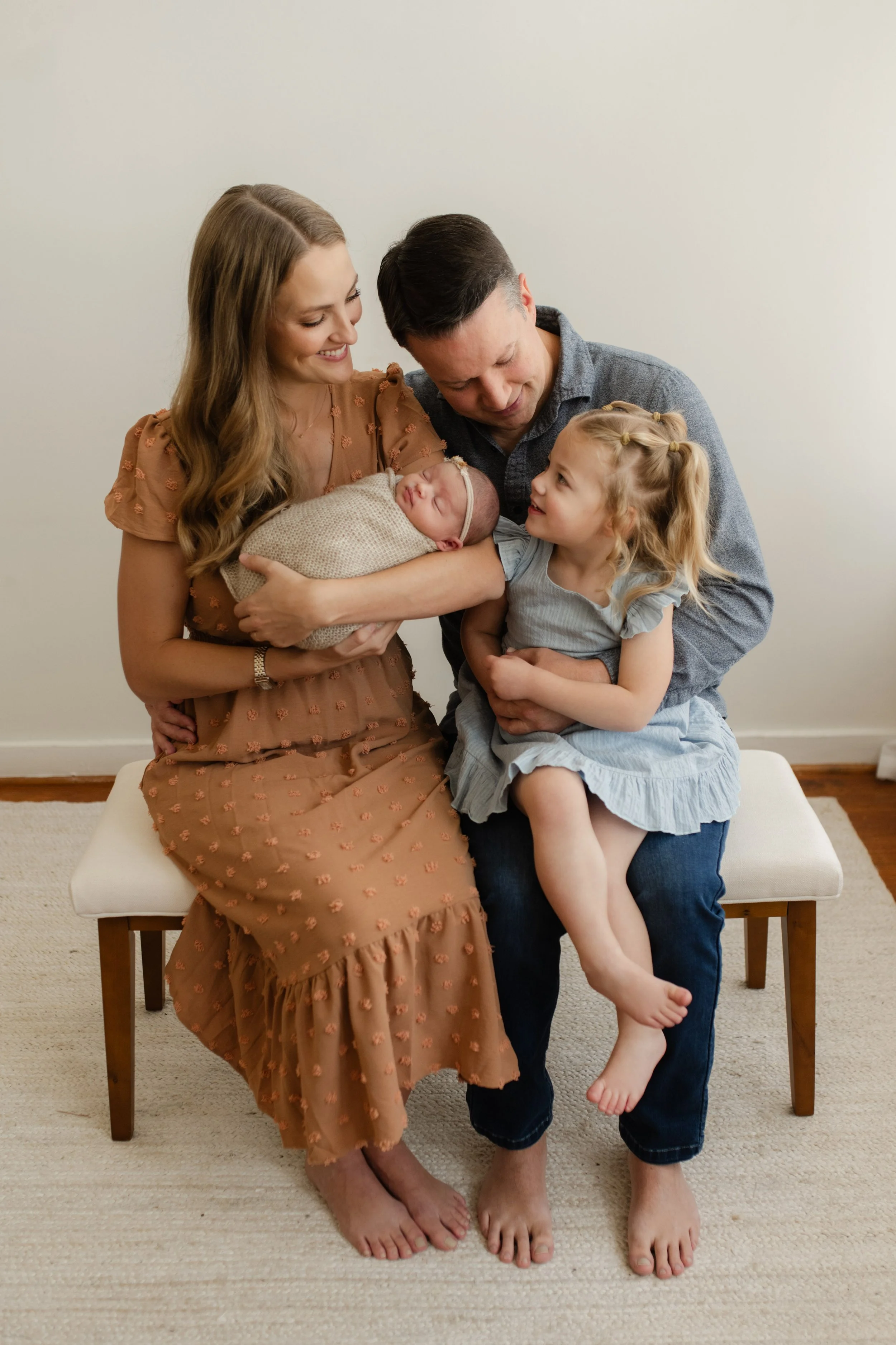 family snuggling together in studio photography springville al