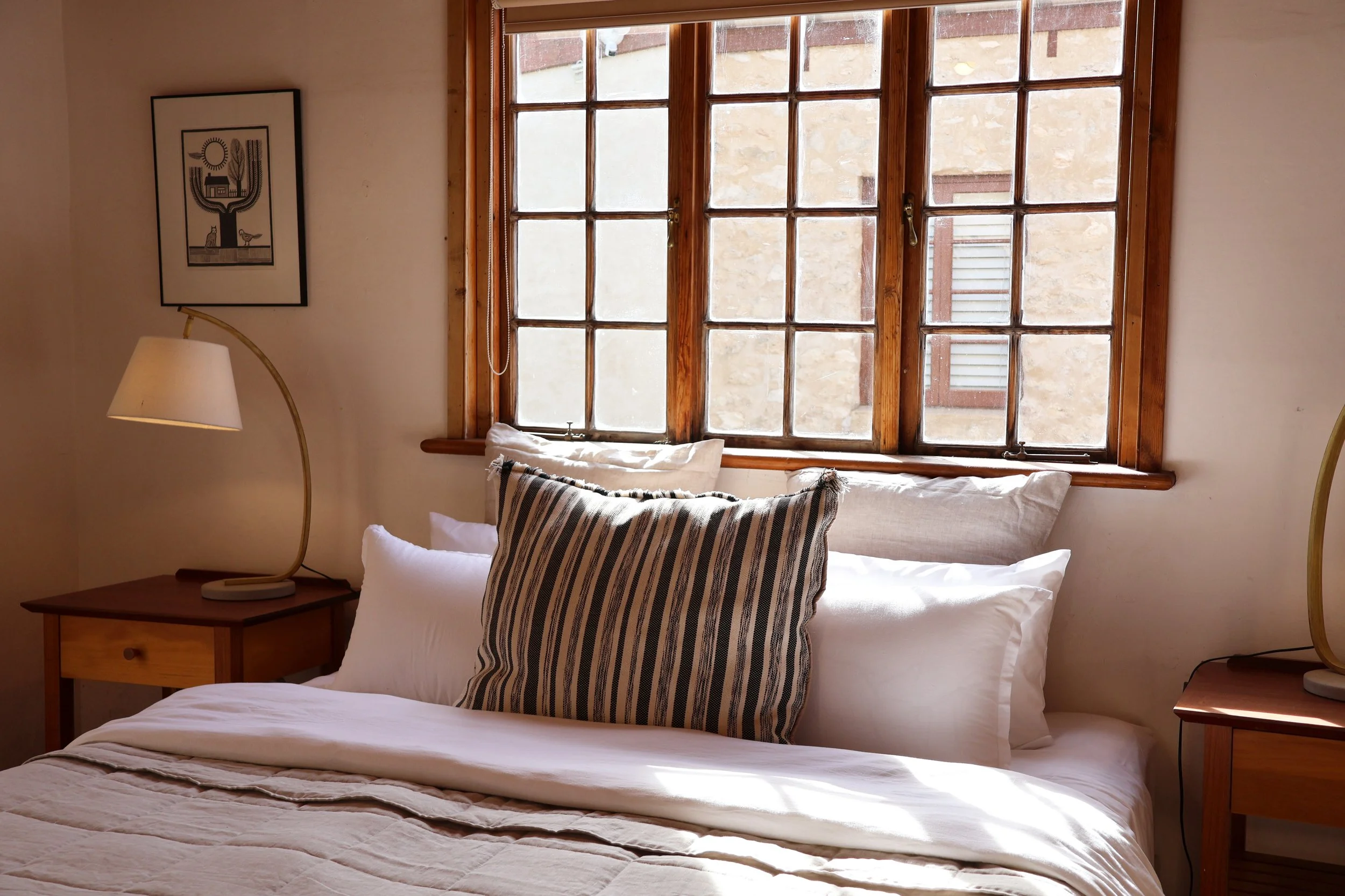 King bed with beautiful linen and natural light