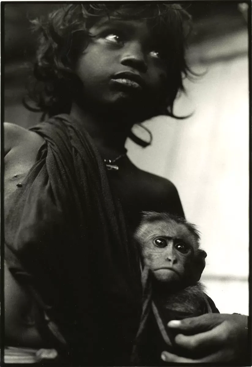 Entry-point-to-India-Gypsy-Child-and-monkey.-Mahaballipuram.webp