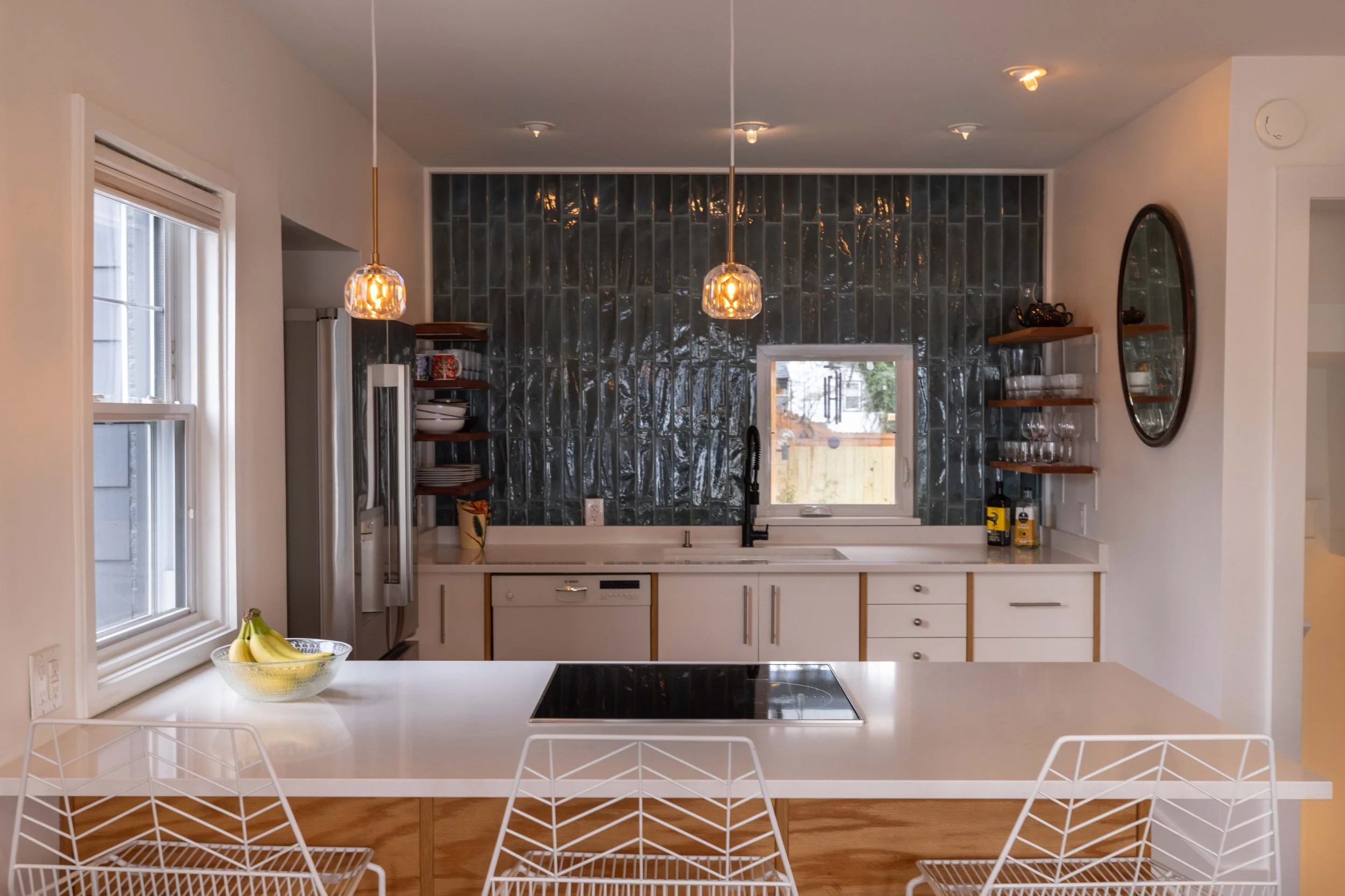 Renovated kitchen with induction cooktop — 1219 Gordon Ave furnished rental.