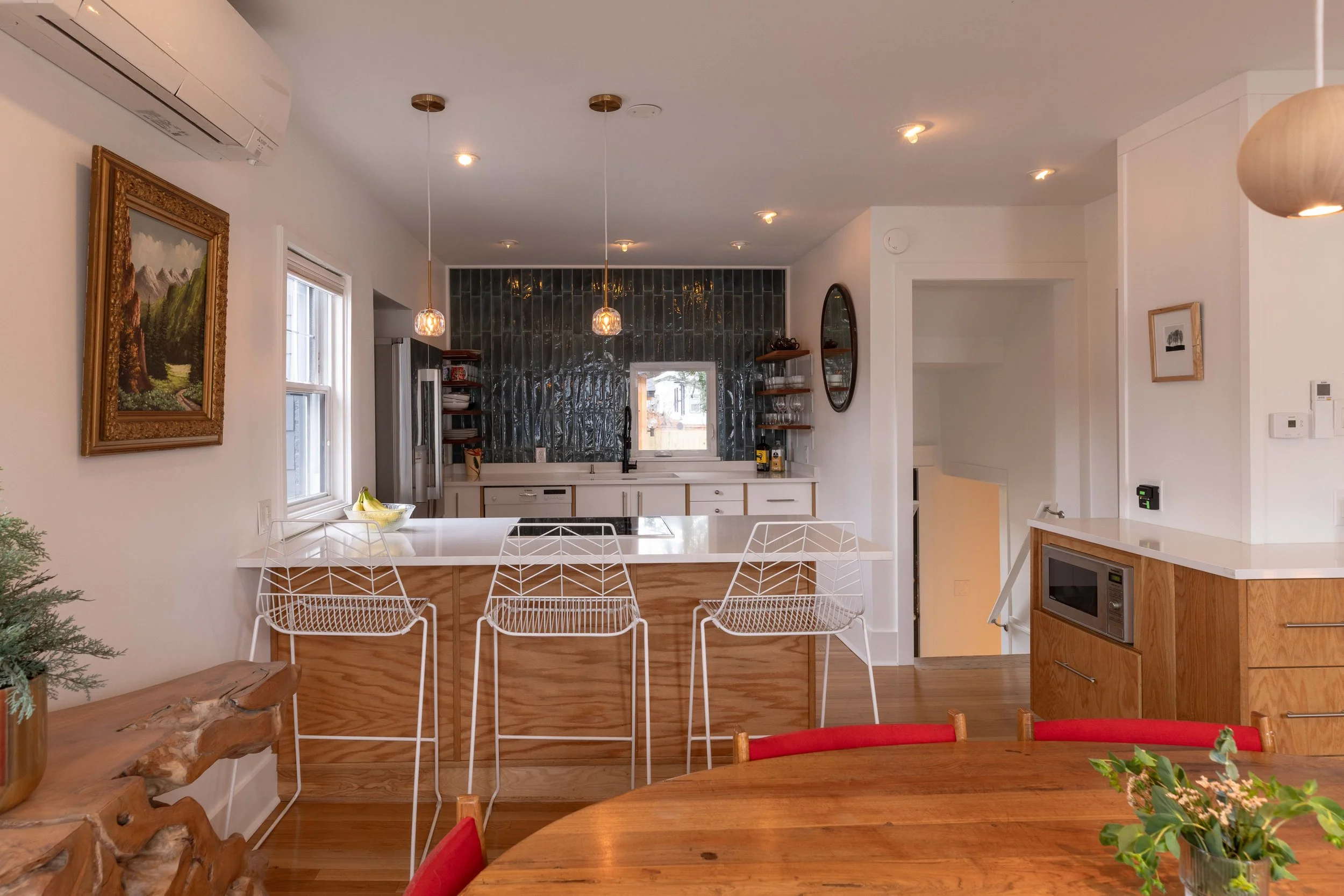 Renovated kitchen with induction cooktop — 1219 Gordon Ave furnished rental.