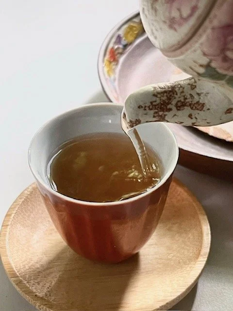 peony gourd teapot pouring tea 1.jpg