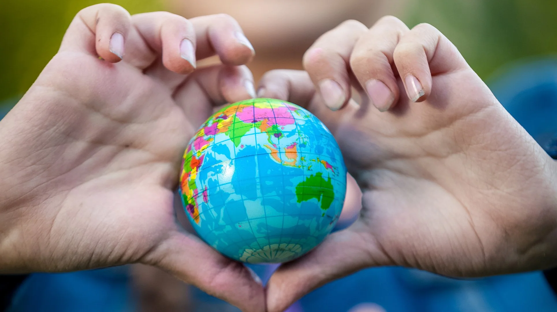 holding-globe-in-hands-folded-in-shap-2023-11-27-04-57-34-utc.jpg