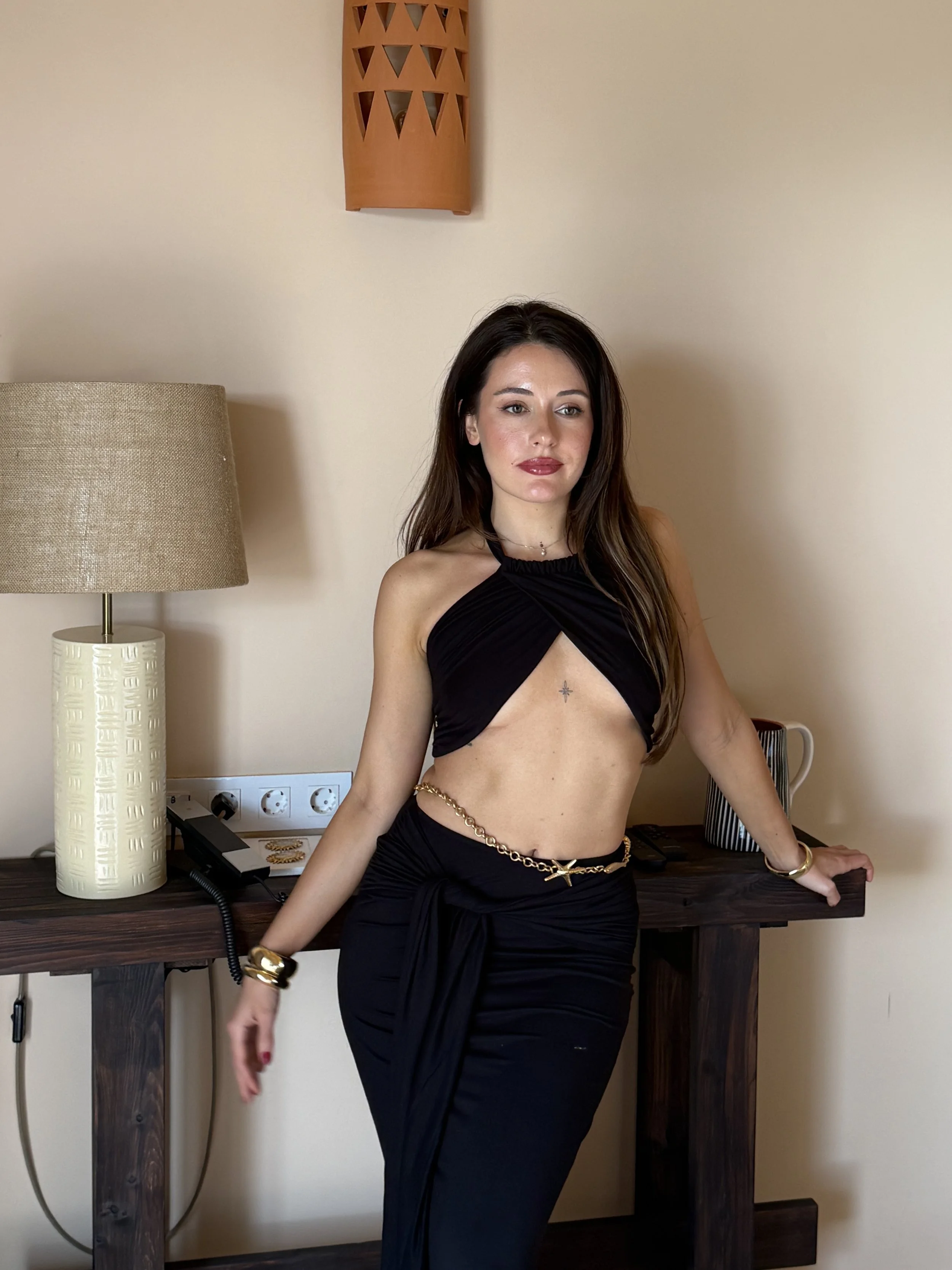 Sol cross-front wrap top in black by SOULLA the Label