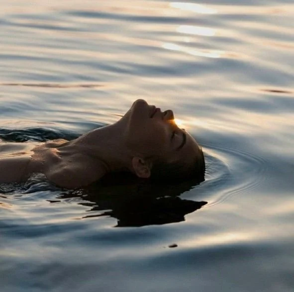Woman resting in water for nervous system regulation