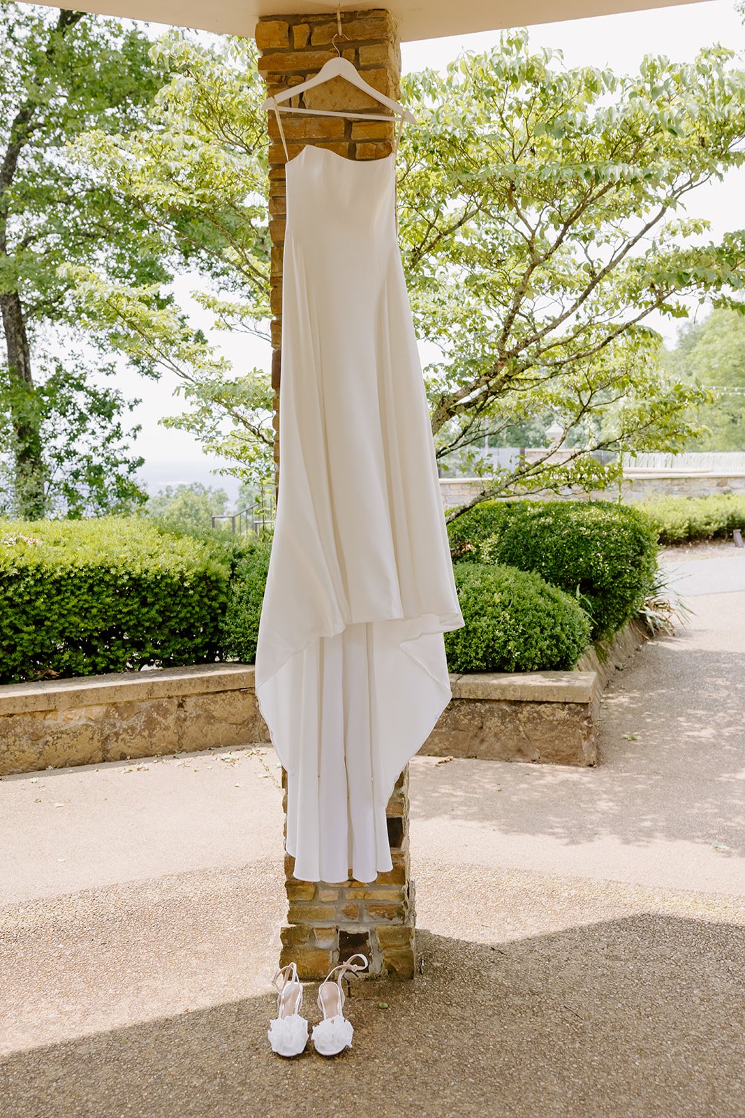 Wedding dress hanging in the pavilion with a mountaintop view in Huntsville, Alabama