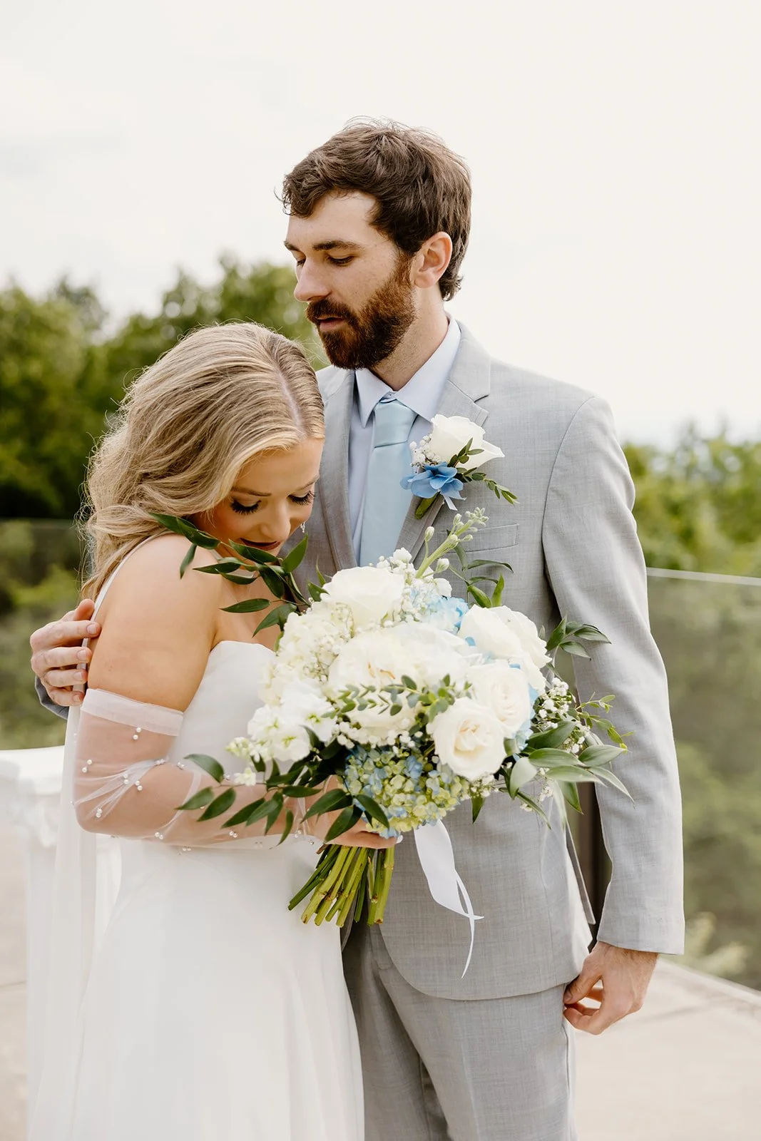 Bride and groom embracing after their first look at Burritt on the Mountain
