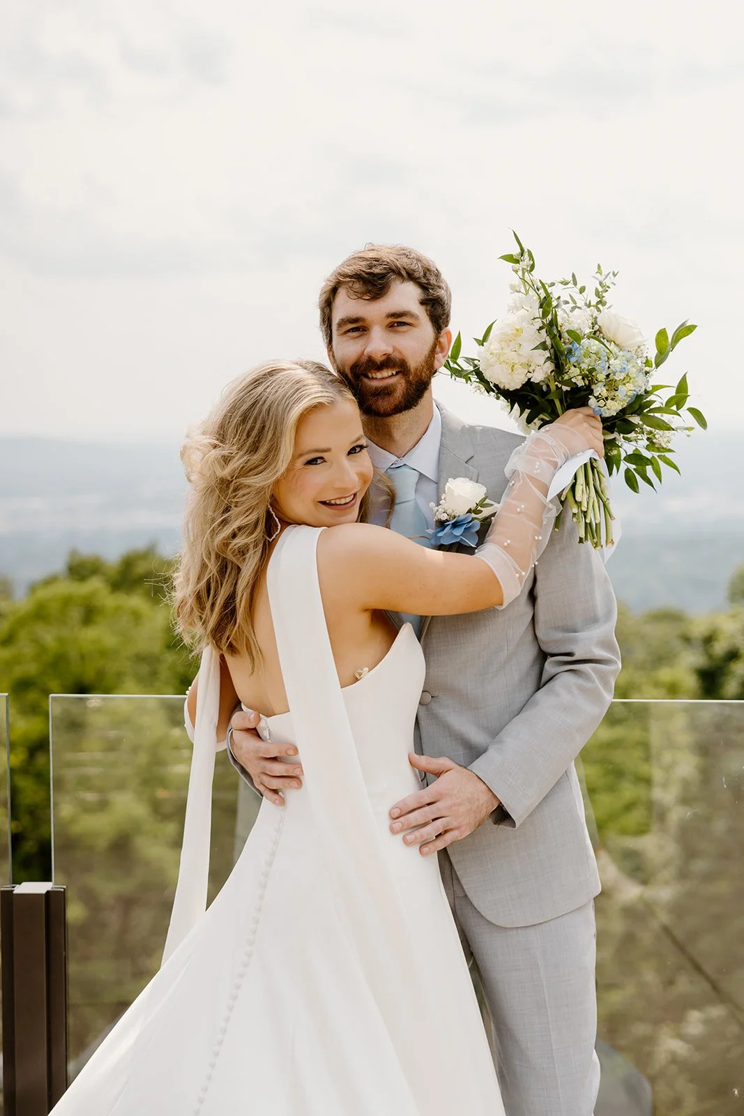 Bride and groom close together at The View overlooking Huntsville, Alabama