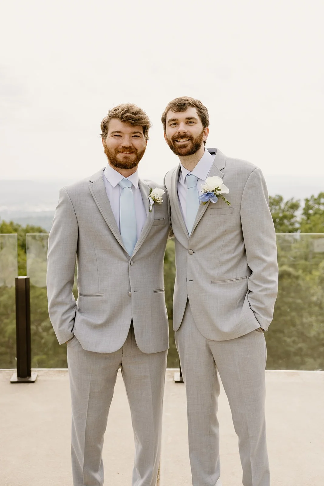 Groom and groomsman in light gray suits at Burritt on the Mountain