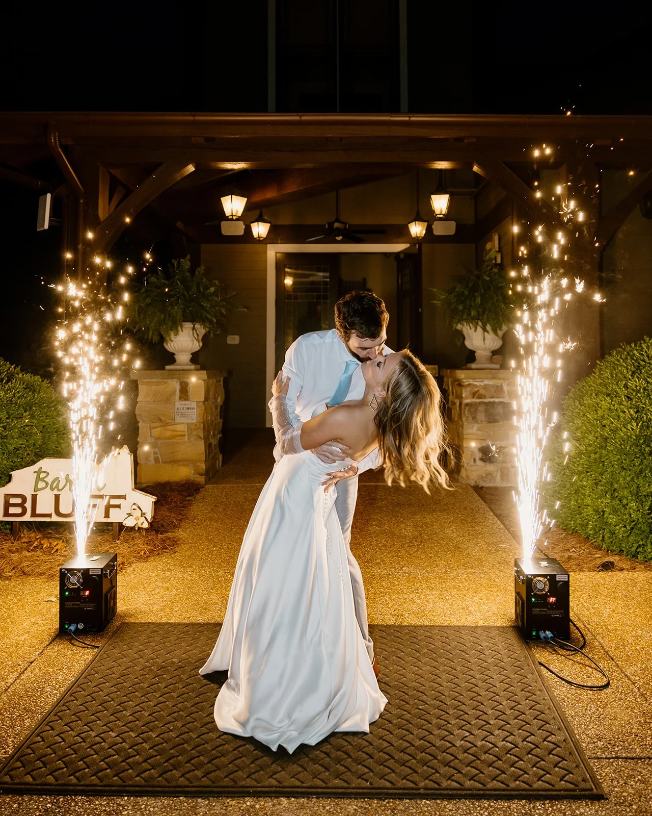 Bride and groom kissing during their spark send off at Burritt on the Mountain