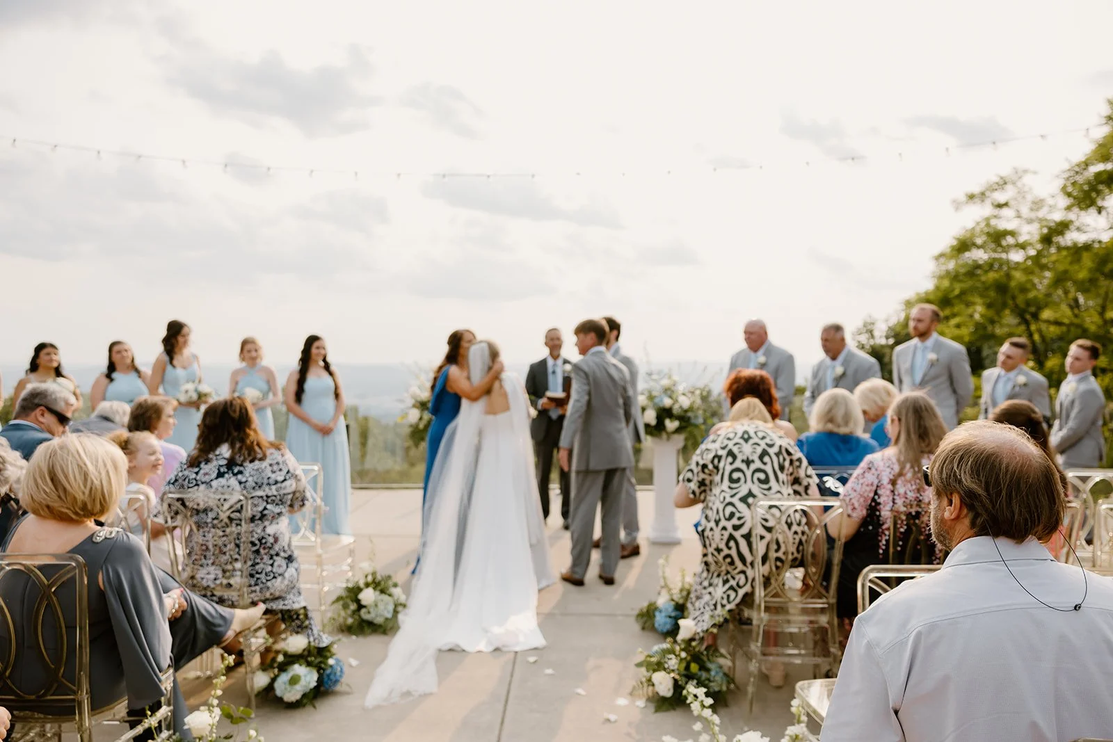 Wide view of Emily and Alex's ceremony at Burritt on the Mountain in Huntsville, Alabama, with the mountain view behind them