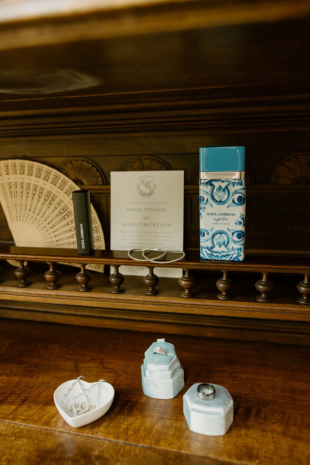 Wedding invitation and bridal details on a shelf at Burritt on the Mountain