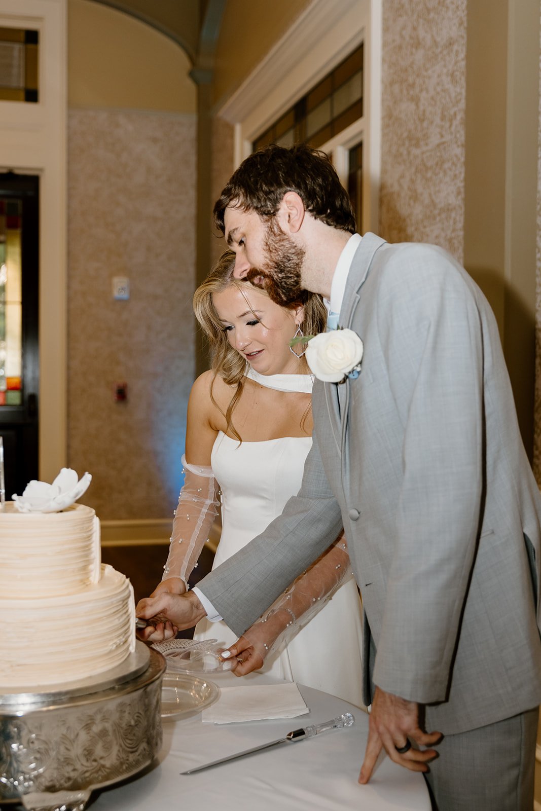 Bride and groom cutting their wedding cake at Burritt on the Mountain