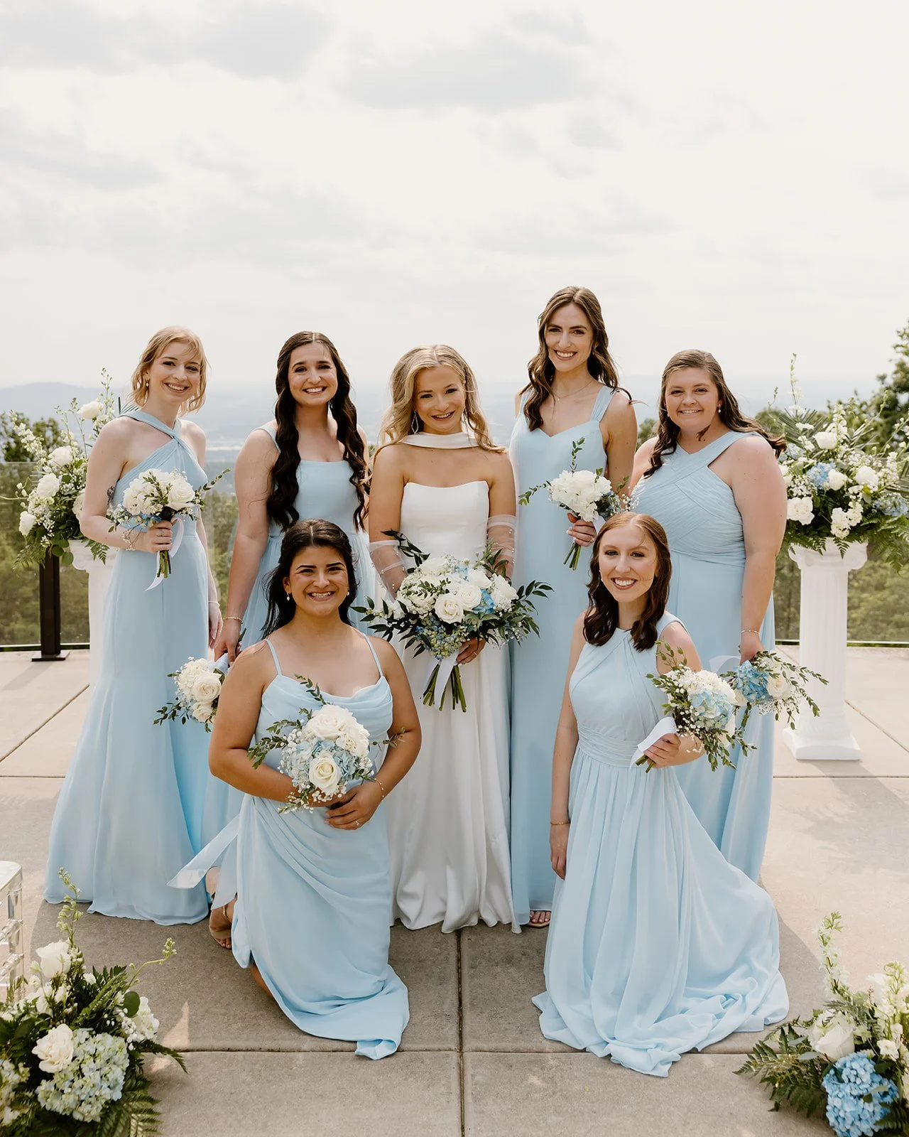 Bride with her bridesmaids in sky blue dresses at Burritt on the Mountain