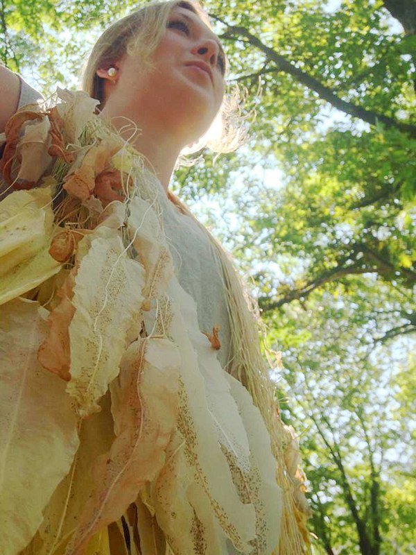 The necklace is comprised of a grouping of approximately one hundred and fifty individual necklaces made from shaped sheets of abaca pulp, waxed linen and various seeds. When the necklace is planted, the seeds embedded within the paper will sprout an
