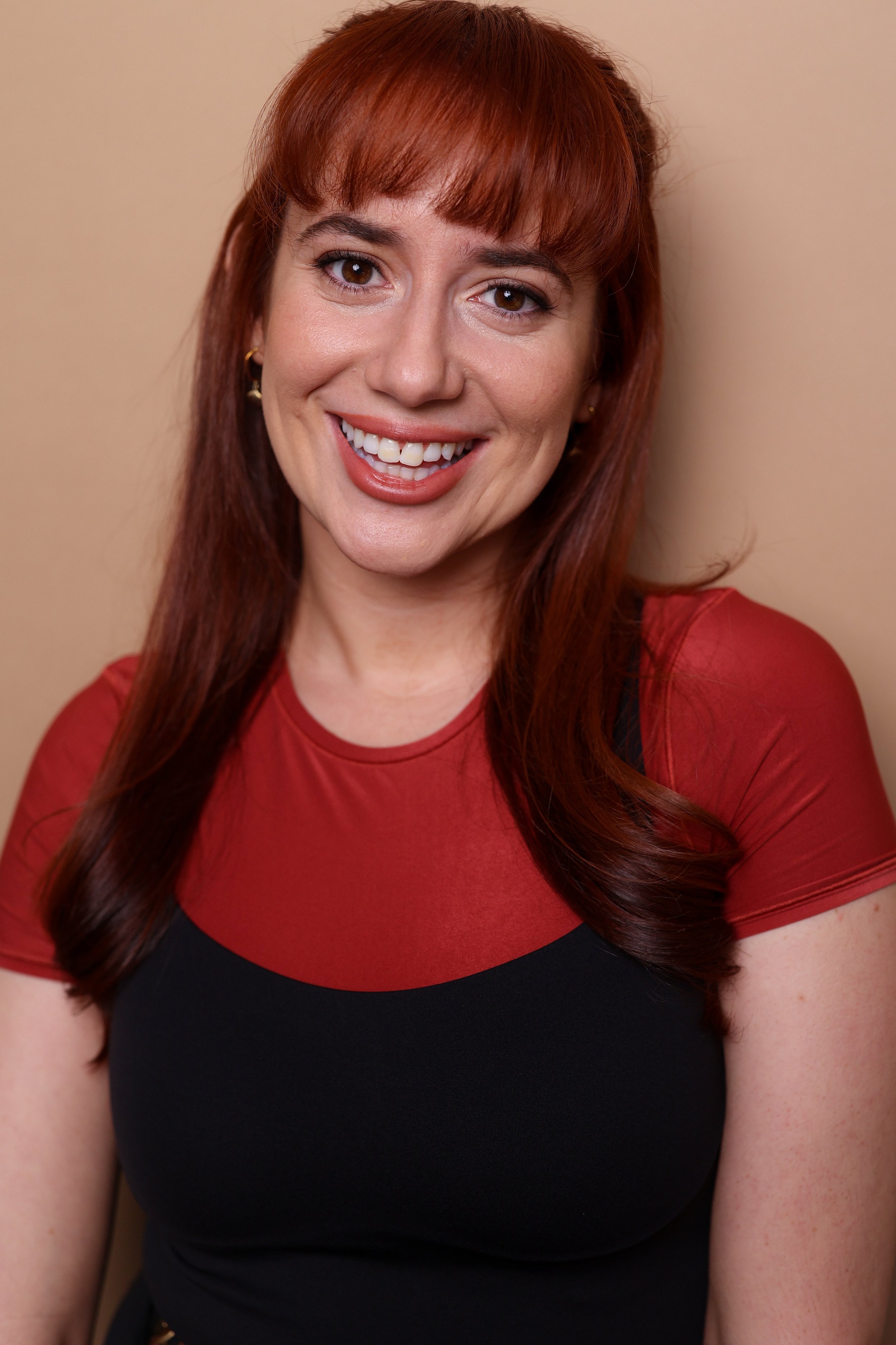 Red Smiling HeadshotM4A8698.jpg