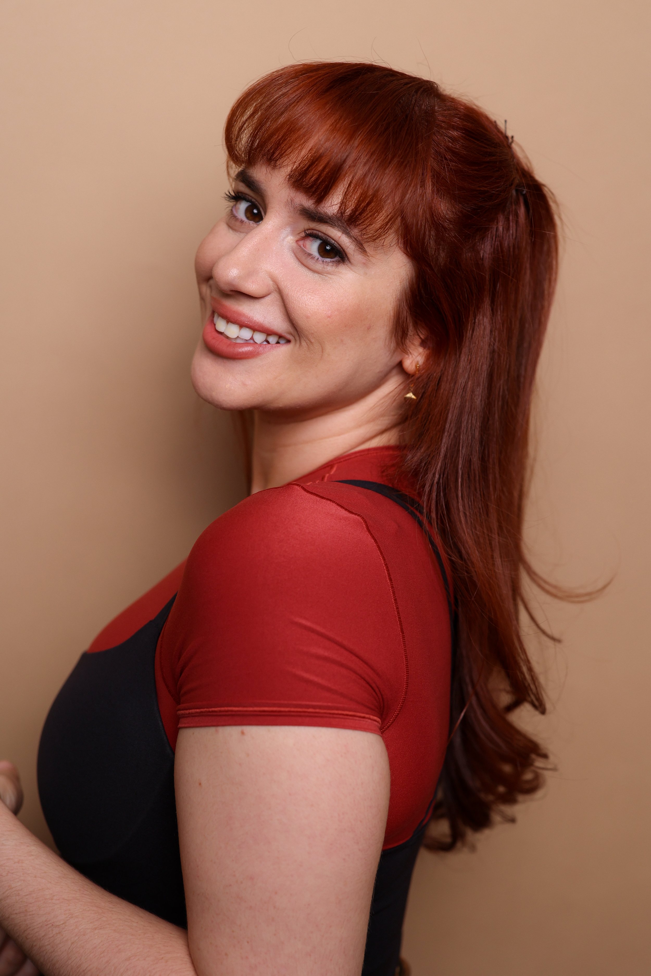 Red Smiling HeadshotM4A8809.jpg