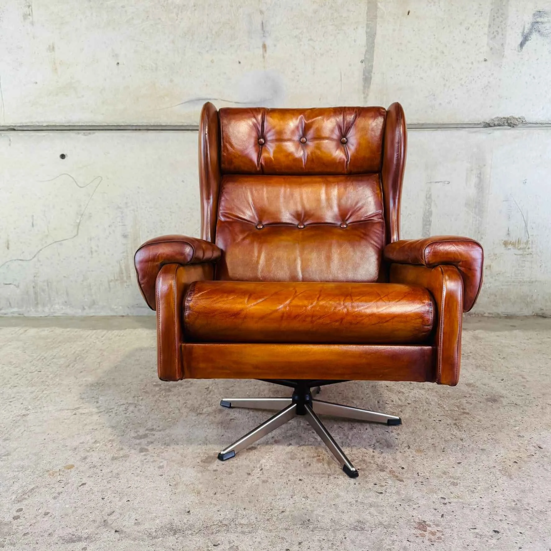 Danish Vintage Cognac Leather Swivel Chair.jpeg