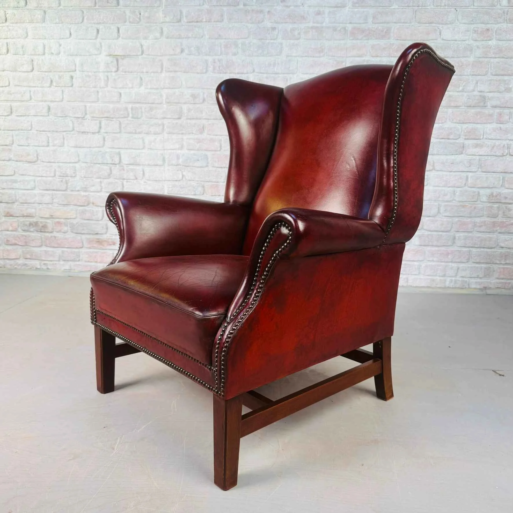 Vintage English Chestnut Brown Deep Red Leather Wingback Chair.jpeg