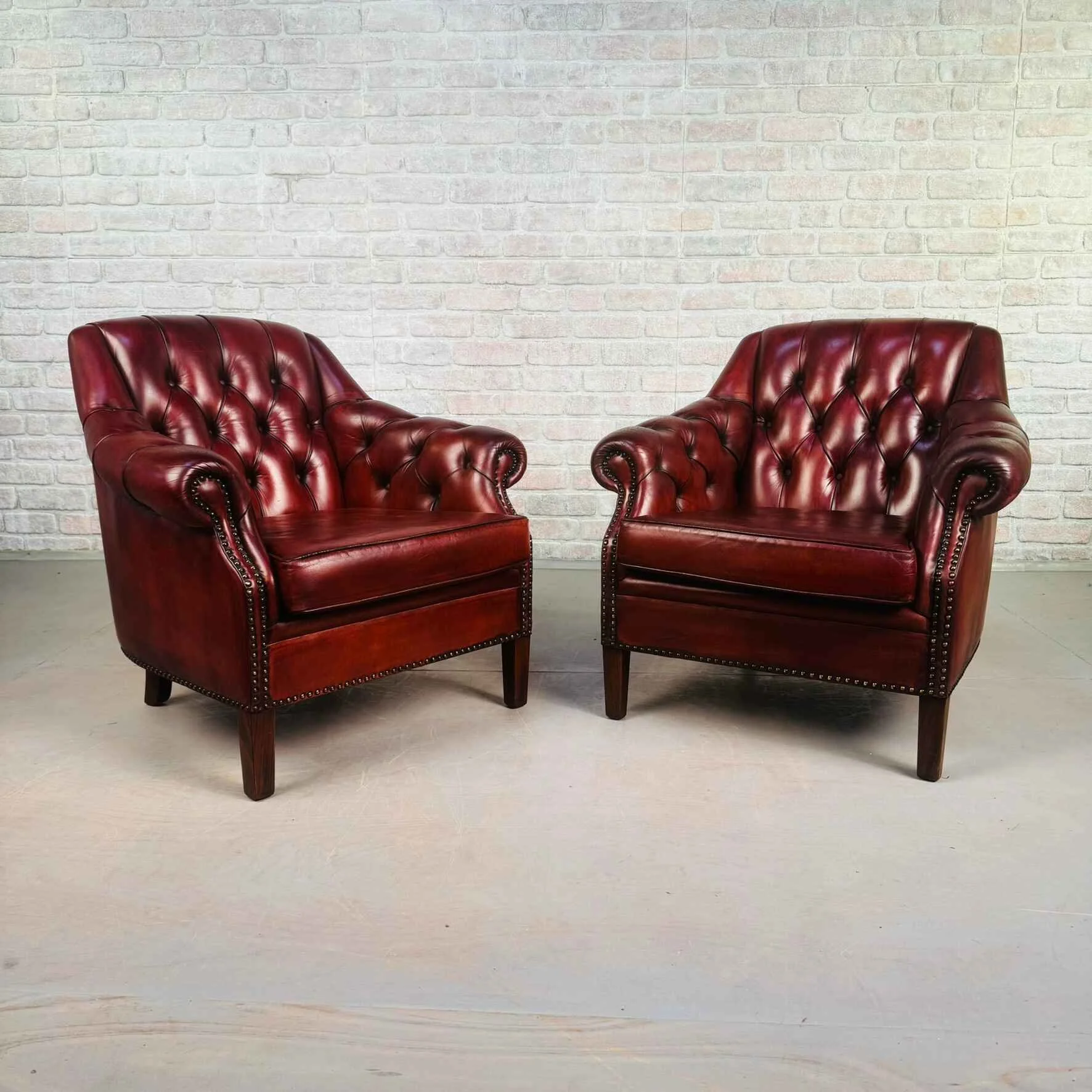 Pair of Vintage Danish Red Leather Armchairs with Studded Back.jpeg