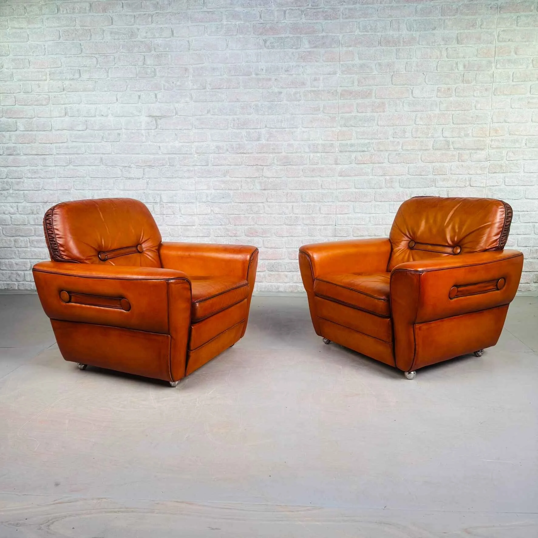 Pair of Elegant Danish Tan Leather Lounge Chairs.jpeg