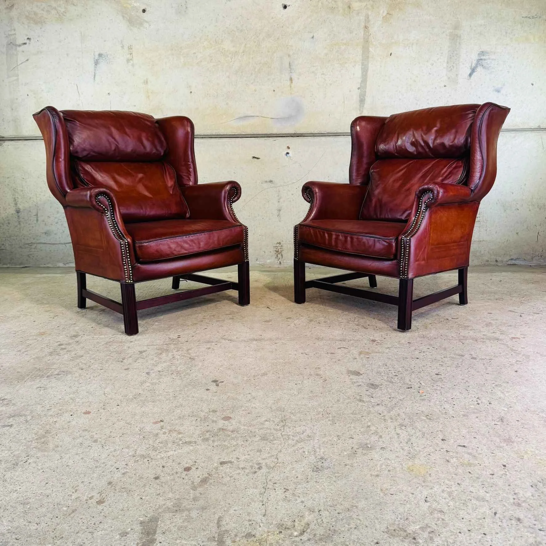 Vintage Pair of English Cognac Leather Wingback Armchairs.jpeg