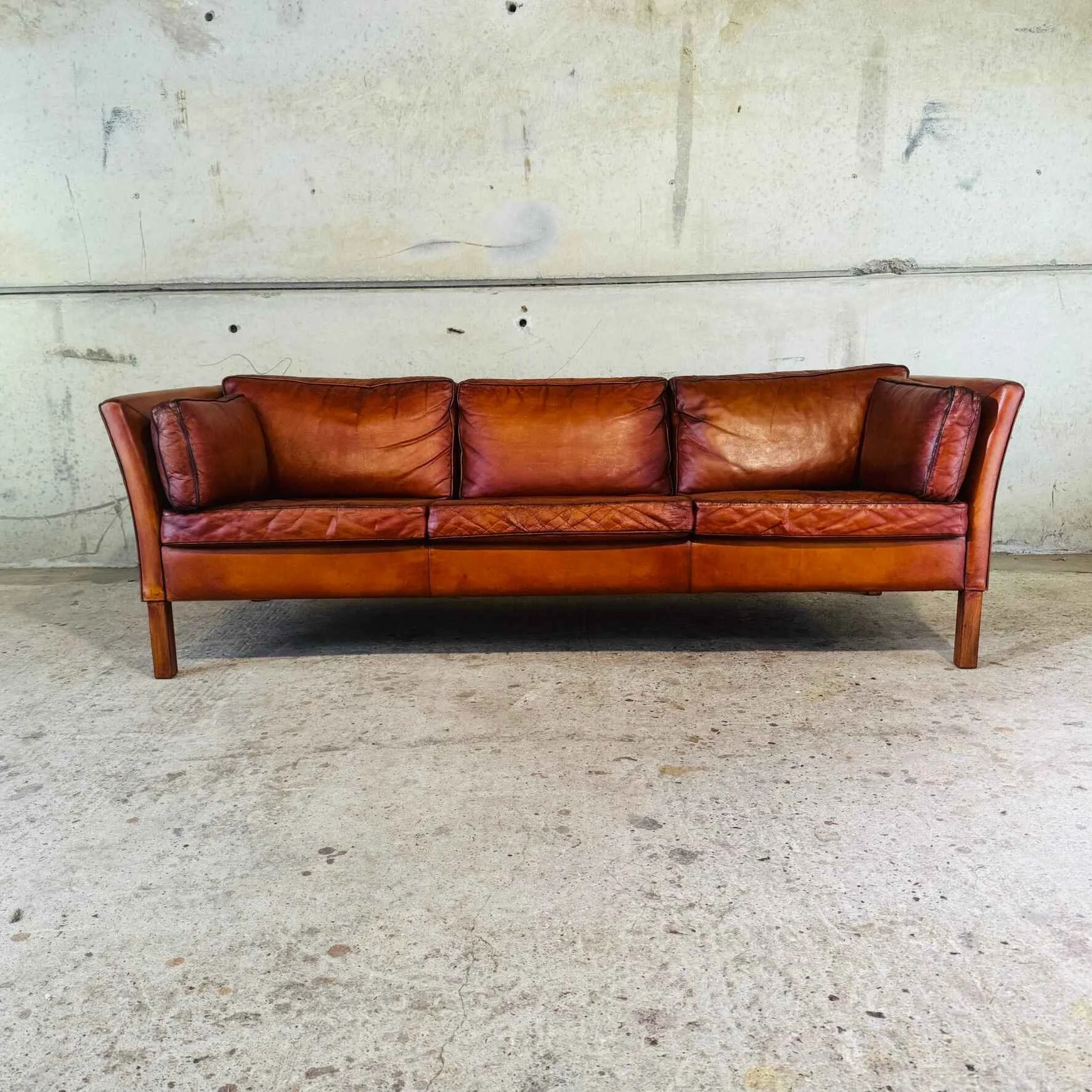 Stylish Danish 1970s Three-Seater Sofa in Cognac Leather.jpeg