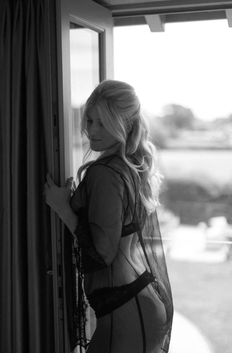   Bride during a luxury bridal boudoir photoshoot in Hampshire, celebrating her upcoming wedding with an elegant and confidence-boosting experience.  