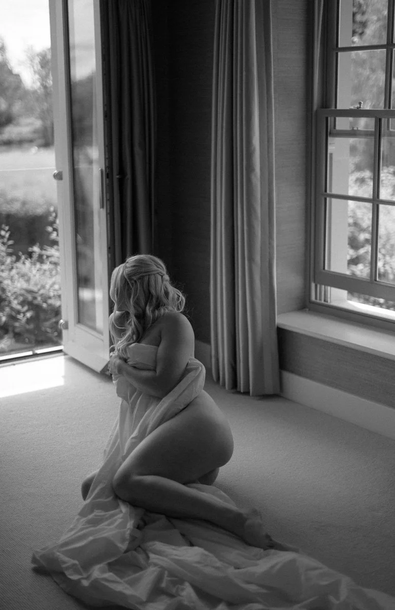  Elegant bridal boudoir portrait of a Hampshire bride preparing for her wedding and creating a meaningful gift for her fiancé. 